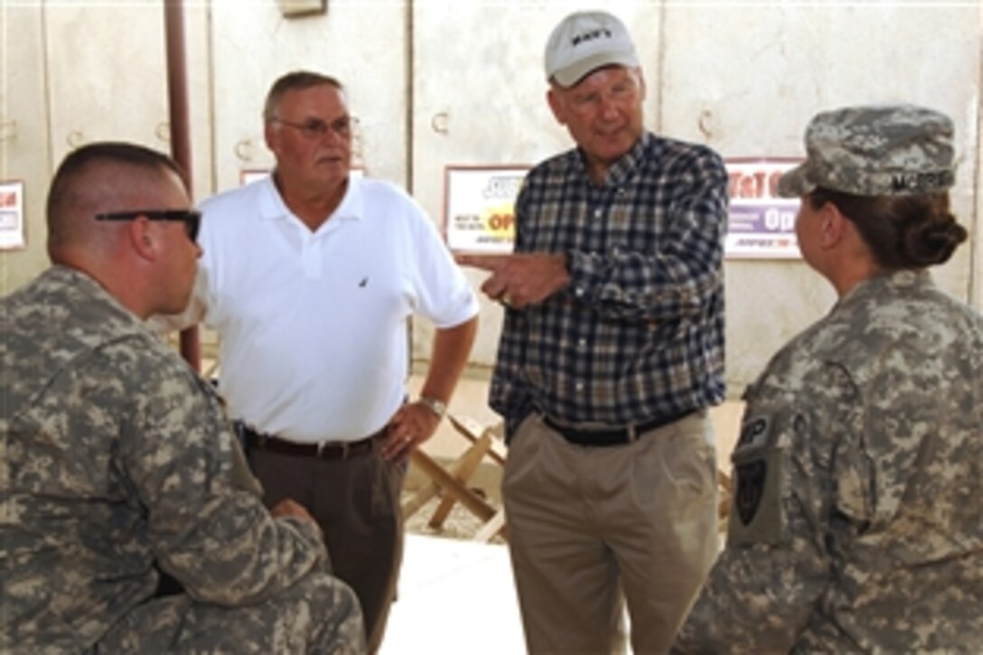 George Lisicki, commander in chief of the Veterans of Foreign Wars, center left, and retired vice admiral Norbert Ryan, president of the Military Officers Association of America, talk with junior officers at Sather Air Base as they all waited for flights out of Iraq, July 30, 2008. Ryan, Lisicki, White House, Department of Defense and national veterans’ organizations members visited central Iraq to gain a better understanding of Multinational Forces-Iraq missions and operations. 