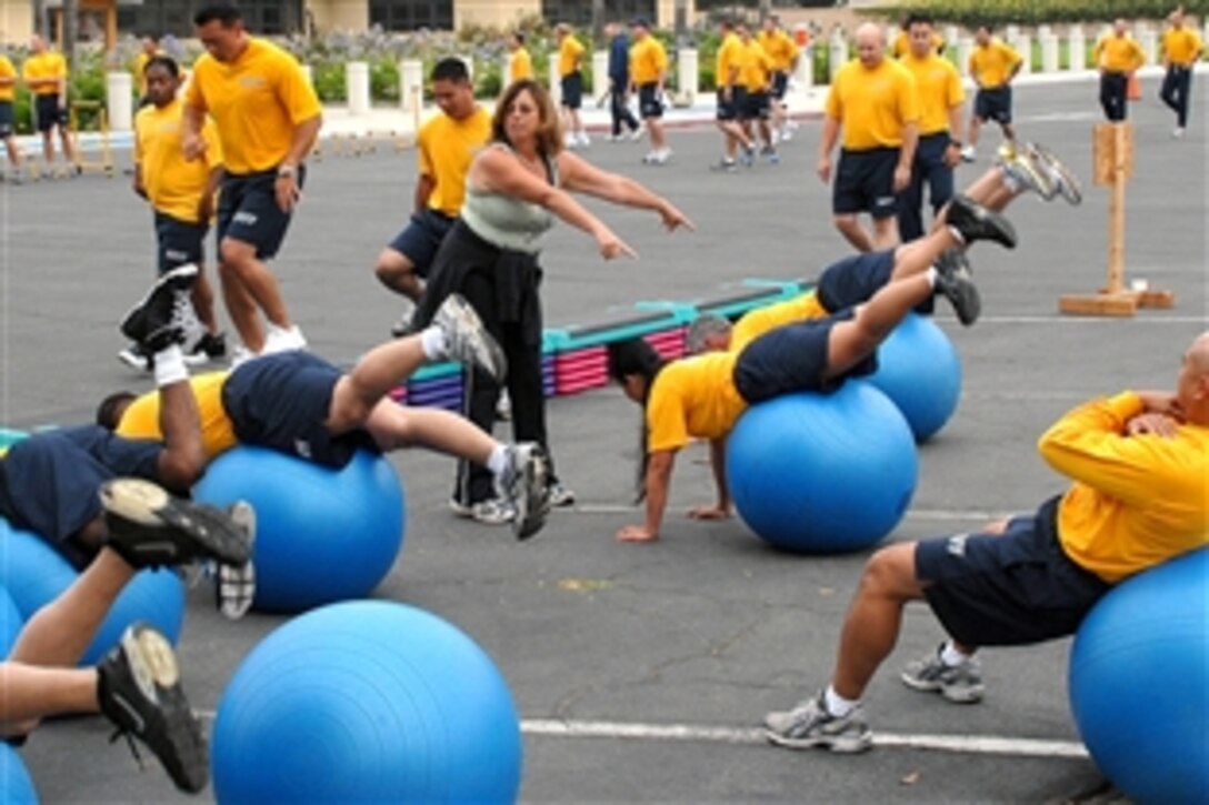 Karen Barton demonstrates an exercise with equipment provided by a U.S Navy fitness van to  assist sailors with staying in shape in Point Mugu, Calif., July 24, 2008. Barton is assigned to the Morale, Welfare and Recreation office on Naval Base Ventura County, Calif. 