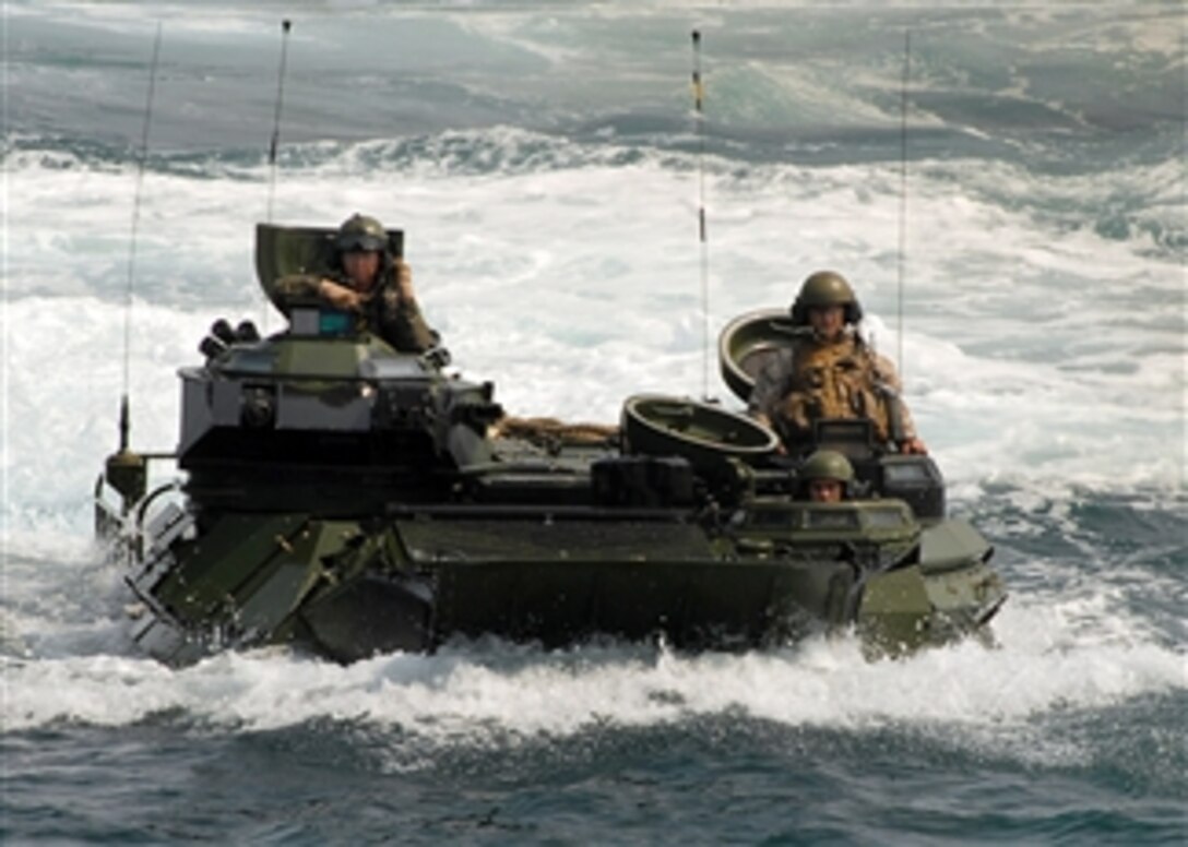 An amphibious assault vehicle assigned to the 26th Marine Expeditionary Unit prepares to board the amphibious dock landing ship USS Carter Hall (LSD 50) while underway in the Atlantic Ocean on July 27, 2008.  The Carter Hall is participating in a joint task force exercise as a part of the Iwo Jima Expeditionary Strike Group.  