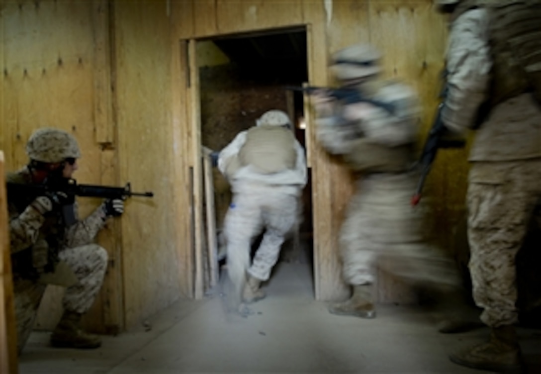 U.S. Marines from the 8th Provisional Security Company clear a room during basic urban survival training at Camp Lemonier, Djibouti, on July 29, 2008.  