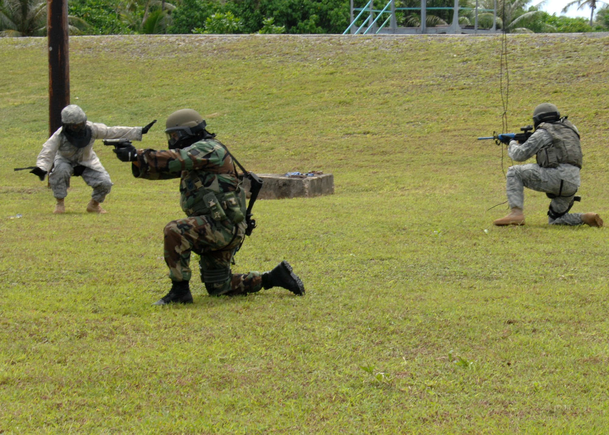 Security Forces Airmen from across the Pacific Air Forces perform live fire scenarios with M-9 Simunition configured training weapons and colored FX rounds during the Commando Warrior simunitions training course at Andersen Air Force Base, Guam July 30.  The five day course was hosted by the 736th Security Forces Squadron and was attended by Security Forces Airmen across the Pacific Air Forces. (U.S. Air Force photo by Airman 1st Class Nichelle Griffiths)