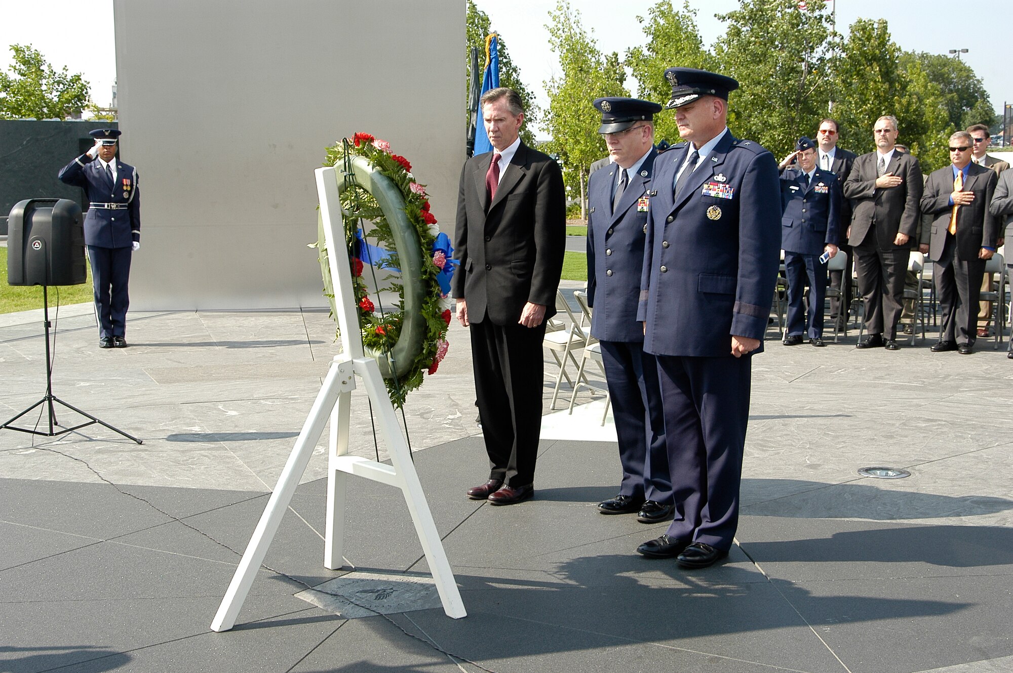 In observance of the 60th Anniversary of the Air Force Office of Special Investigations a wreath is placed at the Air Force Memorial Aug. 1. In a moment of solemn observance are (l to r) Mr. Douglas Thomas, AFOSI Executive Director, Command Chief Master Sgt. Chris Redmond, AFOSI Command Chief and Brig. Gen. Dana Simmons, AFOSI commander. (U.S. Air Force photo/Tech. Sgt. John Jung)