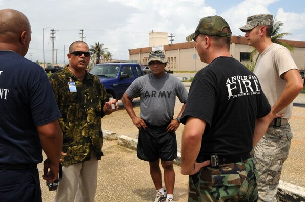 ANDERSEN AIR FORCE BASE, Guam - Michael J. Machado, a logistics planner for the US Army Pacific Joint Task Force - Homeland Defense, discusses the rules for a DoD no-notice mass causality airport disaster workshop held at Won Pat International Airport July 31. Members from the Army National Guard 94th Civil Support Team, Andersen's 36th Civil Engineer Squadron Readiness Flight, Andersen’s fire and emergency services, and Guam Fire Department participated in the workshop. (U.S. Air Force photo by Airman 1st Class Courtney Witt)