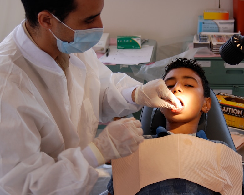 A dental professional treats a Moroccan boy during African Lion 2008. The 151st Expeditionary Medical Squadron, from the Utah Air National Guard, gave aid to Moroccans living in rural areas during the annual exercise. 