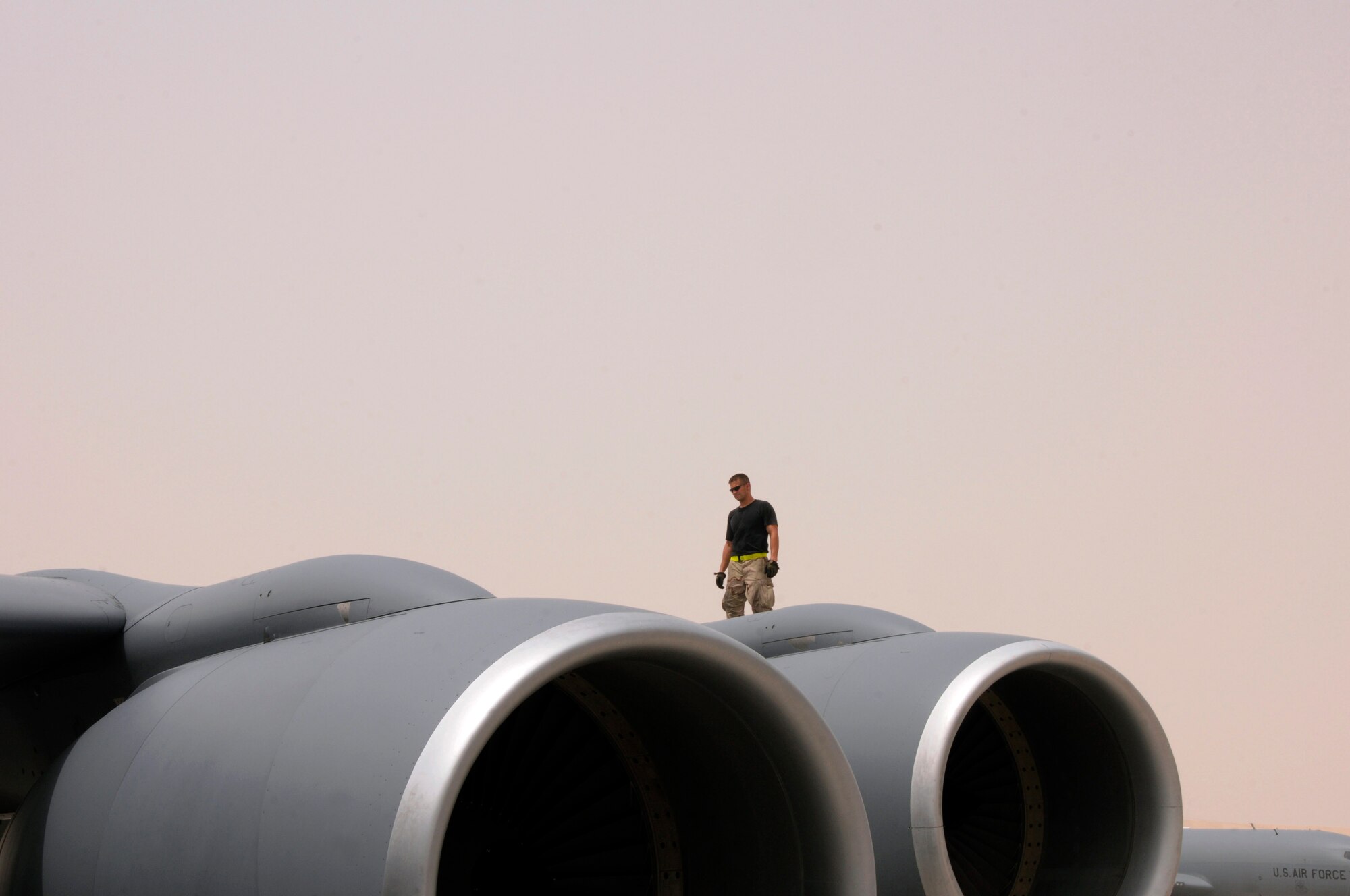 Tech. Sgt. Jim Erickson, a crew chief with the 340th Expeditionary Aircraft Maintenance Squadron from Grand Forks Air Force Base, N.D., walks the wing of a KC-135 as part of a post-flight maintenance inspection Aug. 3, 2008, at an undisclosed location in Southwest Asia.  Sergeant Erickson checks for any maintenance issues that need to be addressed before the aircraft can fly its next mission. The 340th refuels all types of bombers, fighters and other support aircraft engaged in Operations Iraqi Freedom, Enduring Freedom and Combined Joint Task Force Horn of Africa.  (U.S. Air Force photo by Tech. Sgt. Michael Boquette/Released)