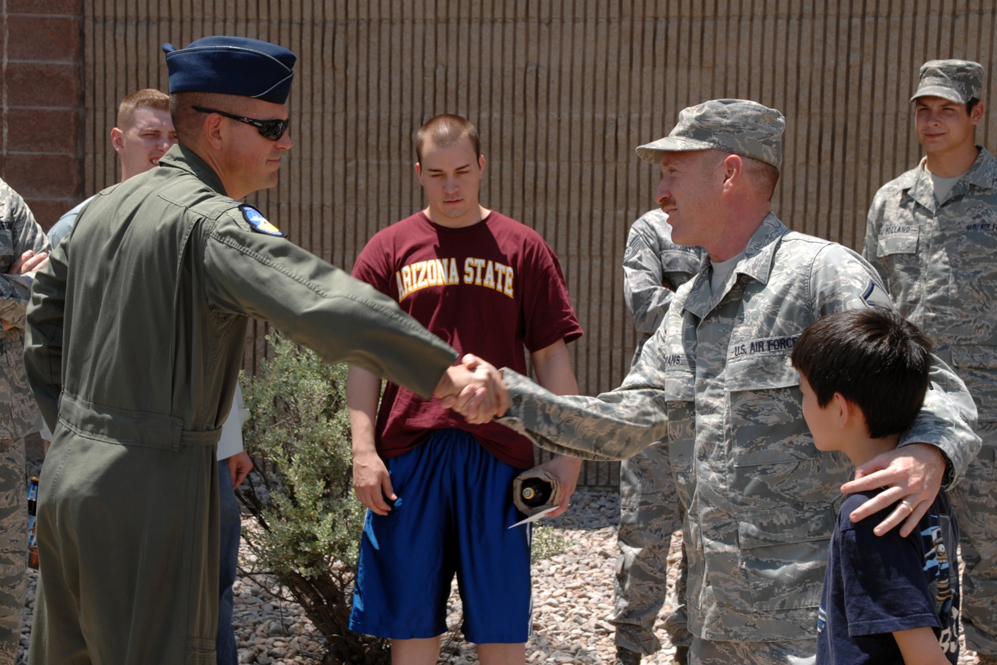 Master Sgt. Sean Bryans, 49th Operations Support Squadron, is welcomed by Col. Michael McGee, 49th Fighter Wing vice commander, Aug. 2 at Holloman Air Force Base, N.M. During his 365-day deployment to Baghdad, Iraq, Seargeant Bryans served as a coalition advisor for the Air Force training team. (U.S. Air Force photo/Airman 1st Class Jamal D. Sutter)