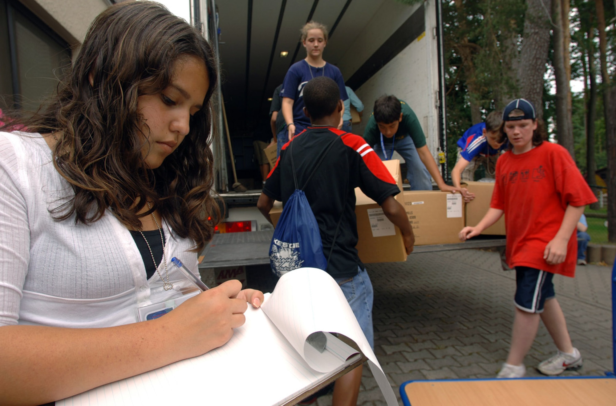 As part of a community outreach project held during the European Keystone Club Leadership Summit taking place at Ramstein Air Base, Germany, 16-year-old Ashley Wyatt, from Spangdahlem AB, Germany, documents furniture and toys that were collected and destined for a Romanian orphanage.  More than 100 teens from 11 U.S. Air Forces in Europe bases attended the week long summit at Ramstein AB from July 28 to Aug. 1.  (U.S. Air Force photo/Master Sgt. Scott Wagers)