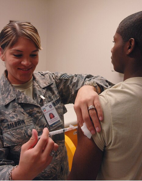 MOODY AIR FORCE BASE, Ga. – Staff Sgt. Georgina Baldwin, 23rd Medical Squadron NCO in-charge of allergy and immunizations, administers an anthrax shot here July 30. Anthrax shots are required for Airmen who are preparing for deployment. (U.S. Air Force photo by Airman Joshua Green)