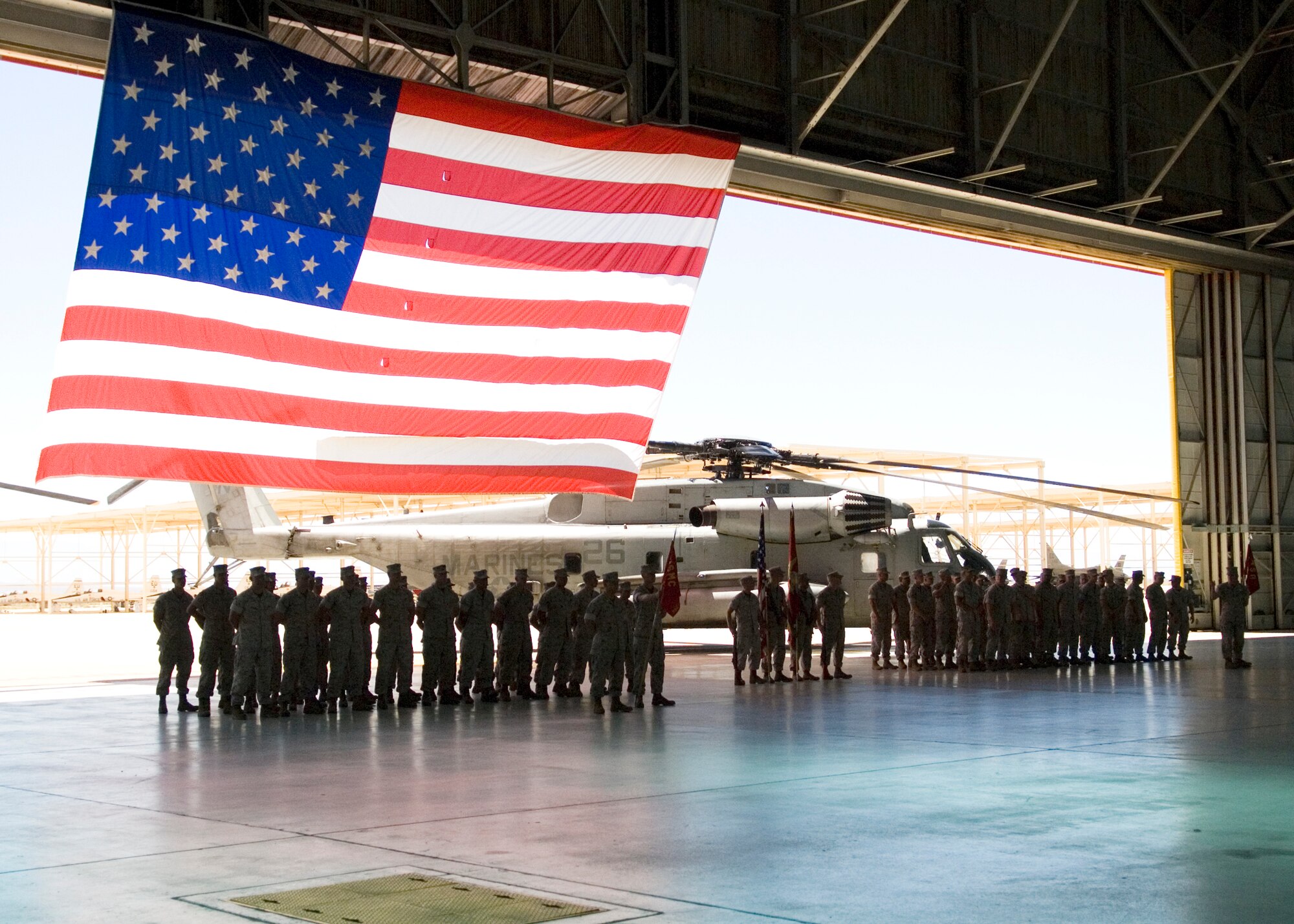 Marines with the Heavy Helicopter Squadron 769 gather at Hangar 1210 for the squadron's deactivation ceremony here Aug. 2. The squadron was responsible for CH-53E Super Stallion transport helicopters. The HMH 769 was activated as Helicopter Transport Squadron 769 on April 15, 1958. The unit provided combat operations support during Operations Desert Shield, Desert Storm and the liberation of Kuwait. (Air Force photo by Edward Cannon)