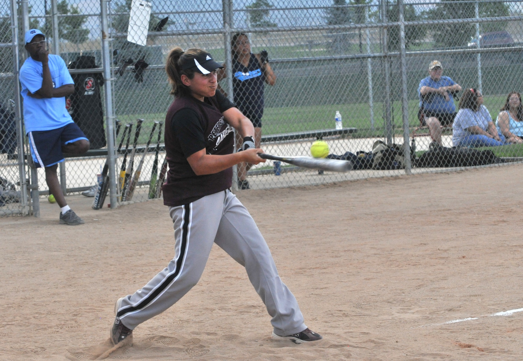 Peterson’s Monica Schwartz blasts a hit to left field during women’s softball action July 30 at Skyview Softball complex in Colorado Springs. Schwartz is assigned to the 21st Force Support Squadron. (CSMNG photo/Walt Johnson)