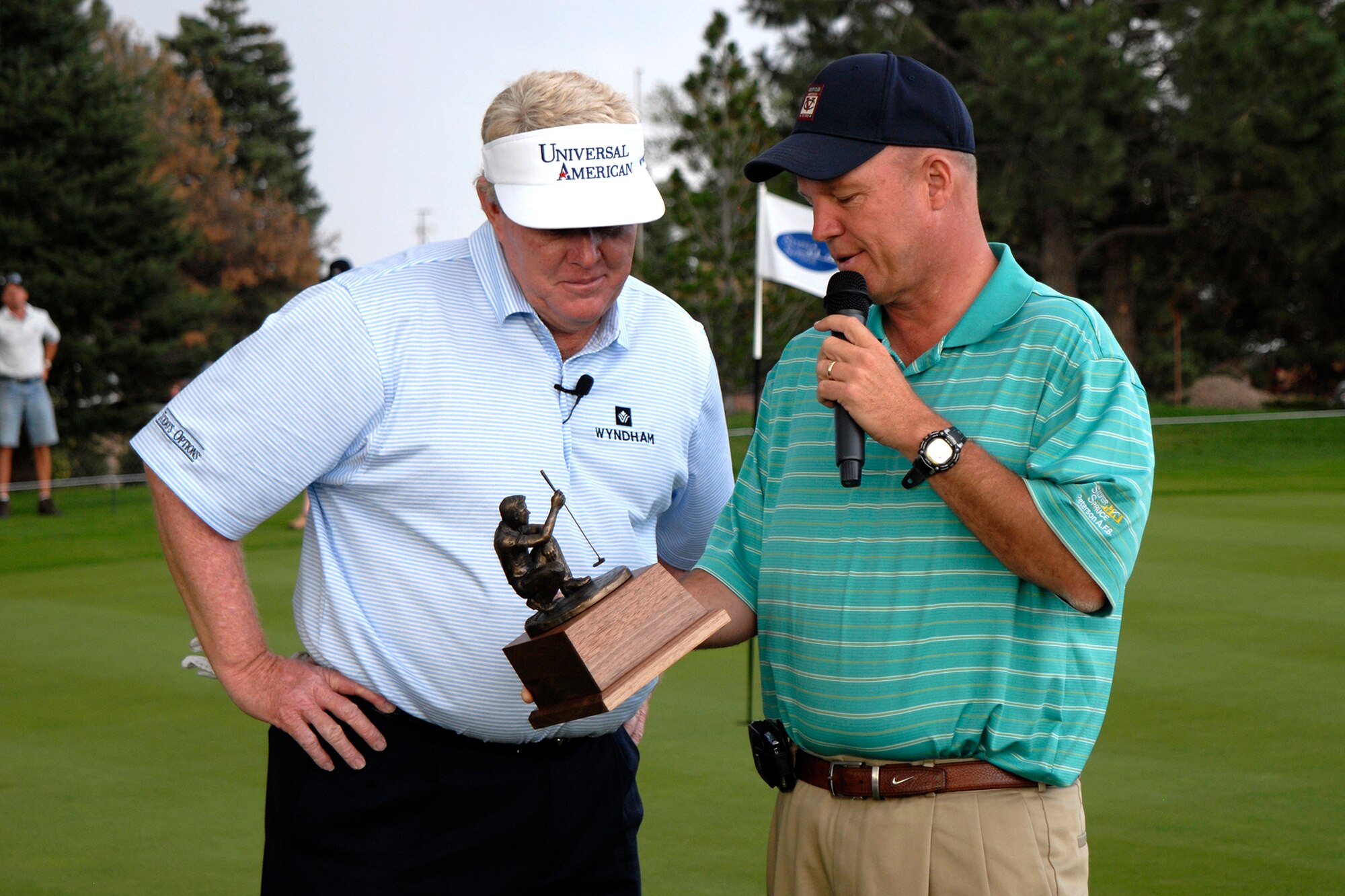Andy Bean (left), a pro golfer with the Professional Golf Association, is presented an award of appreciation by Col. Jay Raymond, 21st Space Wing commander, after a free golf clinic July 29 at the Silver Spruce Golf Course at Peterson Air Force Base, Colo.  Mr. Bean took time out of his schedule to give the golf clinic while attending the U.S. Senior Open competition at the Broadmoor in Colorado Springs, Colo. Mr. Bean, a dominating player on the PGA Tour from 1977-1986, won several minor championships during this time, including the 1977 Doral Eastern Open and the Byron Nelson Golf Classic in 1986. (U.S. Air Force photo/Craig Denton) 