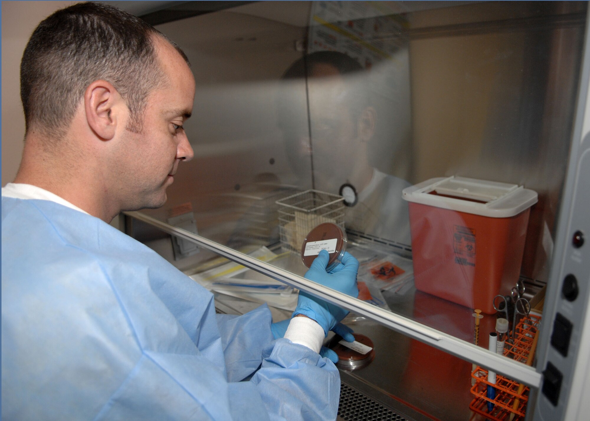 CANNON AIR FORCE BASE, N.M.-- Tech. Sgt. Michael Buongiorne, 27th Special Operations Medical Support, examines bacteria to determine if blood platelets are still working and growing properly in the clinical laboratory June 20. Sergeant Buongiorne checked the blood to identify microorganisms and make sure that patients are healthy. (US Air Force photo by Airman Maynelinne De La Cruz)