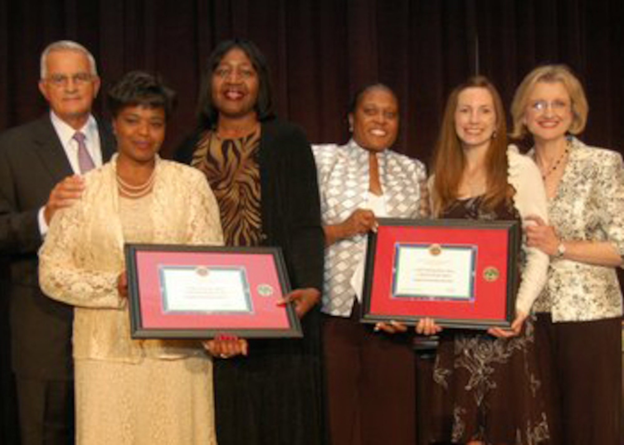 (left to right) Retired General Thomas Schwartz, Military Child Education Coalition Board of Directors chairman; Teresa Barrow-Mohammed, 61 MSS Airman & Family Readiness Center; Elois McGehee, Los Angeles Unified School District; Essie Whitworth-Nurse, former 61 MSS Airman & Family Readiness Center; Melanie Arvonio, 61 MSS Airman & Family Readiness Center; and Dr. Mary Keller, MCEC executive director come together at the 10th Annual MCEC's 2008 Conference held at Grapevine. Texas, July 23. Los Angeles Air Force Base and local Los Angeles schools won the "Pete Taylor Partnership of Excellence Award" for their outstanding joint venture in educational success for military children.