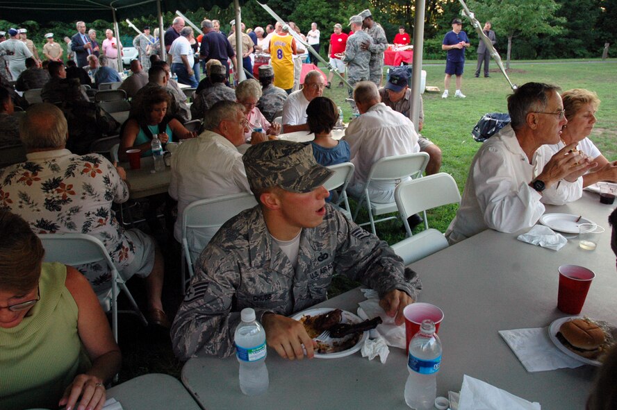 Staff Sgt. James Chubb (center), from the U.S. Air Force Expeditionary Center at Fort Dix, N.J., was among more than 50 Airmen from McGuire Air Force Base, N.J., and Fort Dix to the 2008 Burlington County Military Affairs Committee "Medal of Honor" picnic July 31 at the Palmyra Nature Cove.  Nearly 100 military members from all services were on hand to attend the picnic which also featured Medal of Honor recipient, former 1st Lt. Brian M. Thacker of the U.S. Army and a Wheaton, Md., resident.  (U.S. Air Force Photo/Tech. Sgt. Scott T. Sturkol)