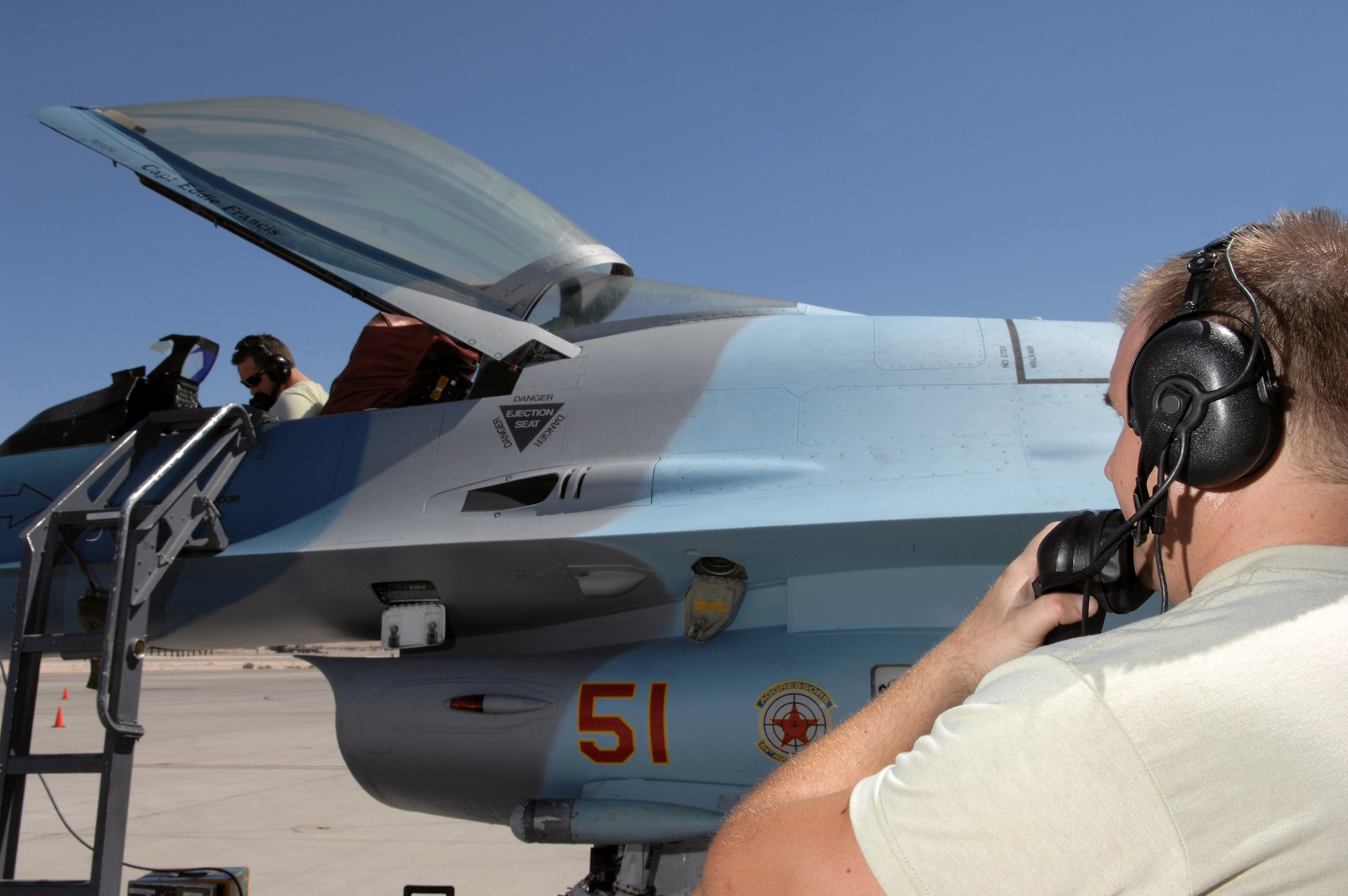Senior Airman Shawn Ohagan (left) Staff Sgt. Giovanni Conti conduct a radar functional check on an F-16 July 24 at Nellis Air Force Base, Nev. The 926th Group is an Air Force Reserve unit under the 10th Air Force, Naval Air Station Joint Reserve Base, Fort Worth, Texas. The group is located at Nellis AFB as an associate unit to the Air Force Warfare Center. Through total force integration, reservists are integrated into active duty Air Force units, accomplishing the mission alongside active-duty Airmen on a daily basis. Both Airmen are F-16 avionics specialist assigned to the 926th Group Det. 2. (U.S. Air Force photo/Senior Airman Larry E. Reid Jr.)
