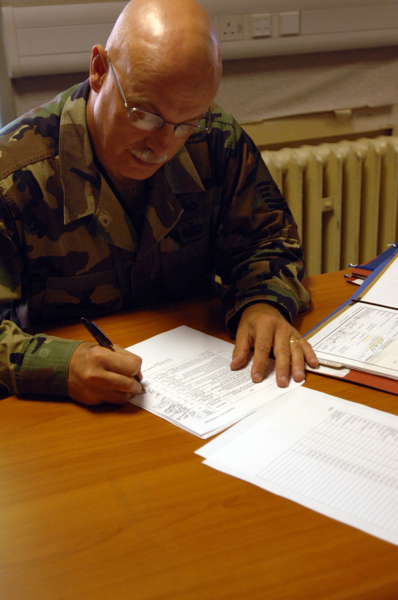 Master Sgt. Tim Stidhams, 446th Logistic Readiness Flight, McChord Air Force Base, Wash., reviews various support agreements while here on his 15-day tour July 25, 2008. (U.S. Air Force photo by Senior Airman Teresa M. Hawkins)