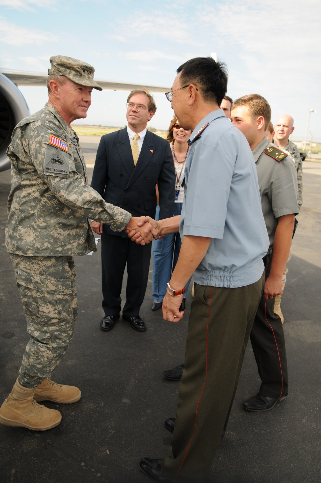 MANAS AIR BASE, KYRGYZ REPUBLIC--Lt. Gen. Martin Dempsey, acting U.S. Central Command commander, greets members of the Kyrgyz Republic military shortly after arriving at Manas Air Base Aug. 1. General Dempsey and other CENTCOM officials visited the base as a part of a routine tour of the command's area of operations, which stretches from the Kyrgyz Republic to Africa. Manas AB is the premeir air mobility hub supporting ongoing operations in Afghanistan. (Air Force photo / Airman 1st Class Ruthann Holcomb)