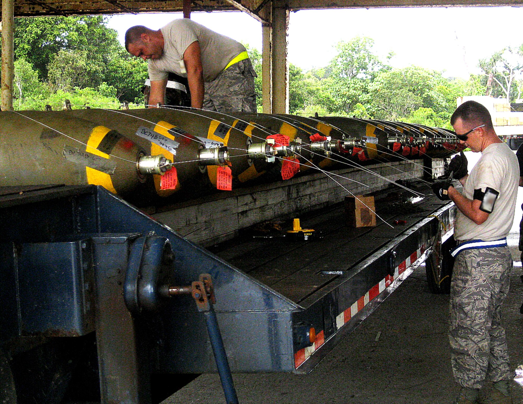 Airmen  from the 36th Munitions Squadron build 117M bombs at the at 9105 Pad during the Ammunition Production Exercise (CAPEX) that took place here July 28 through Aug. 2. The CAPEX continues to be the best tool available for all levels of command within the logistics community to evaluate munitions combat readiness, training requirements, and Combat Munitions Plan adequacy. (Courtsey photo)

