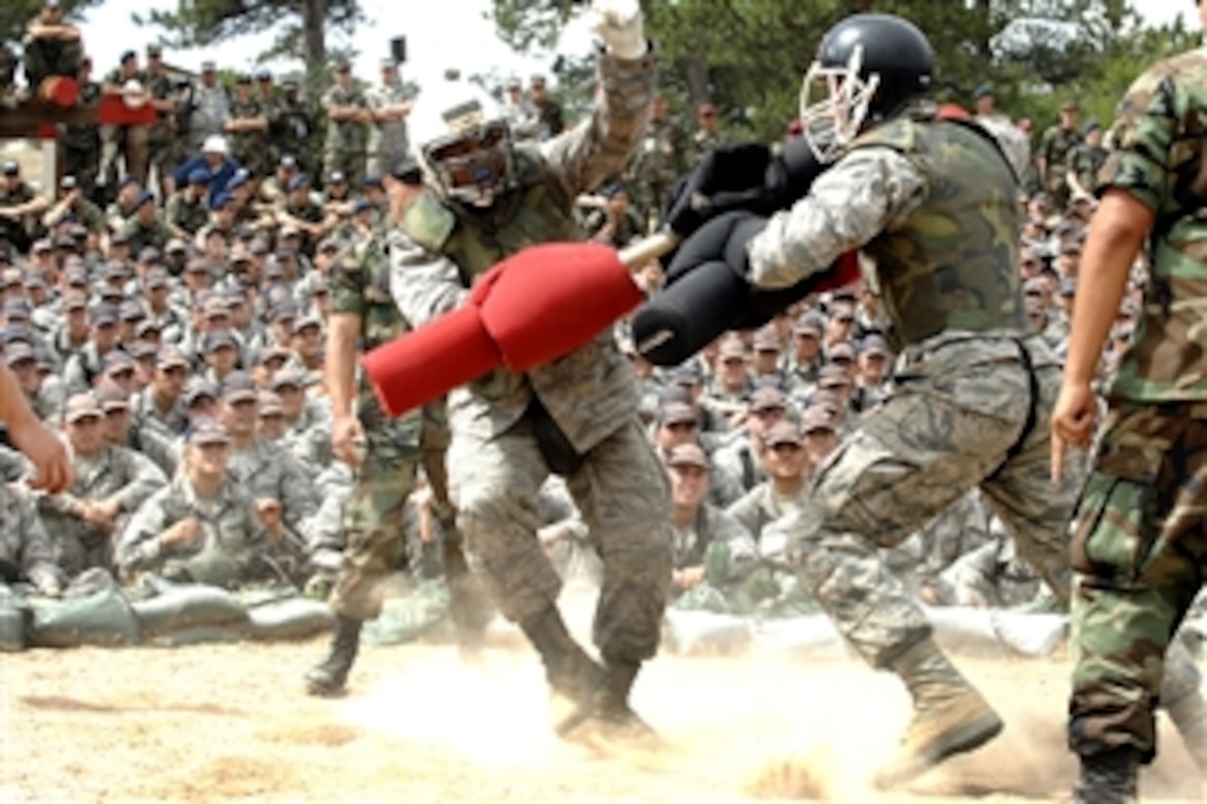 U.S. Air Force Academy basic cadets James Franklin, left, and Jonathan Newman fight with pugil sticks during the Big Bad Basic portion of field training at the academy in Colorado Springs, Colo., July 30, 2008. 