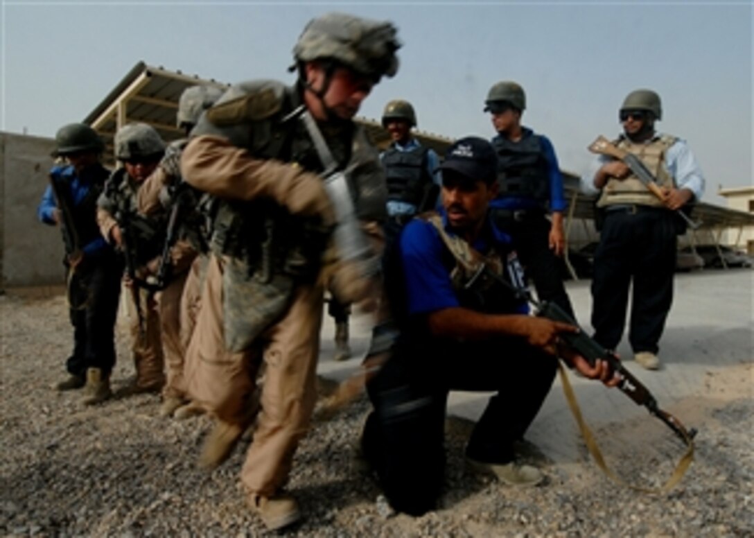 U.S. service members conduct police transition training with Iraqi police officers in Baghdad, Iraq, on July 31, 2008.  