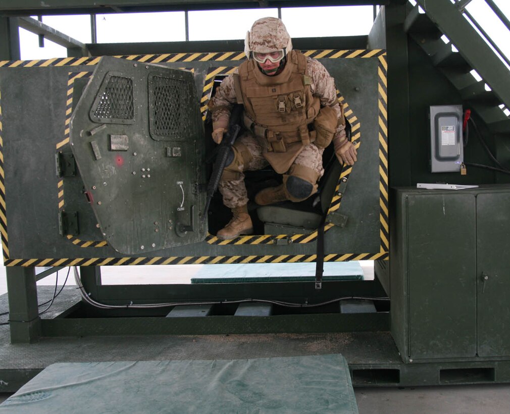 Capt. Ryan O’Connor, assistant logistics officer for 2nd Battalion, 25th Marine Regiment, leaps out of the Humvee Egress Assistance Trainer during the battalion’s pre-deployment training at Mojave Viper Aug. 4, 2008.  O’Connor was an Individual Ready Reservist who mobilized for a year to deploy to Iraq with the reserve infantry battalion.