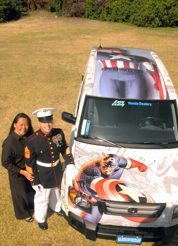 Sgt. Major Jayme F. Winders, 12th Marine Corps District sergeant major, and his wife, Lisa, stand by their new Captain America themed Honda Element they won in a drawing at Comic–Con. Winders is thankful for his wife entering them in the drawing for the car because he said he wouldn’t have entered otherwise.