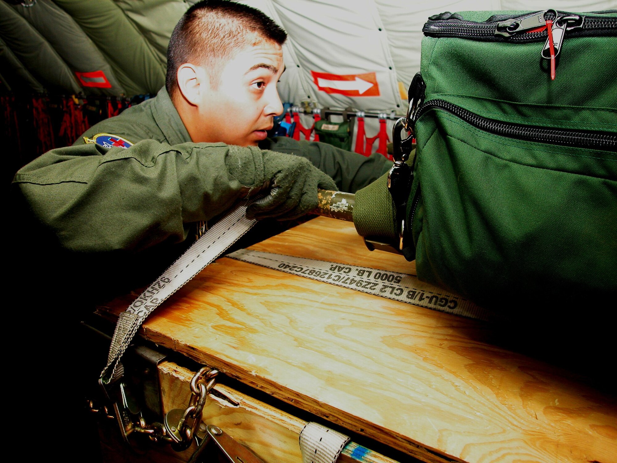 Senior Airman Bill Ortega helps a team member secure a weighted litter
during pre-flight operations for a training mission in St. Croix, U.S. Virgin Islands last week. A KC-135 from the 336th Air Refueling Squadron provided support for the mission. (U.S. Air Force photo by Staff. Sgt. Joe Davidson)