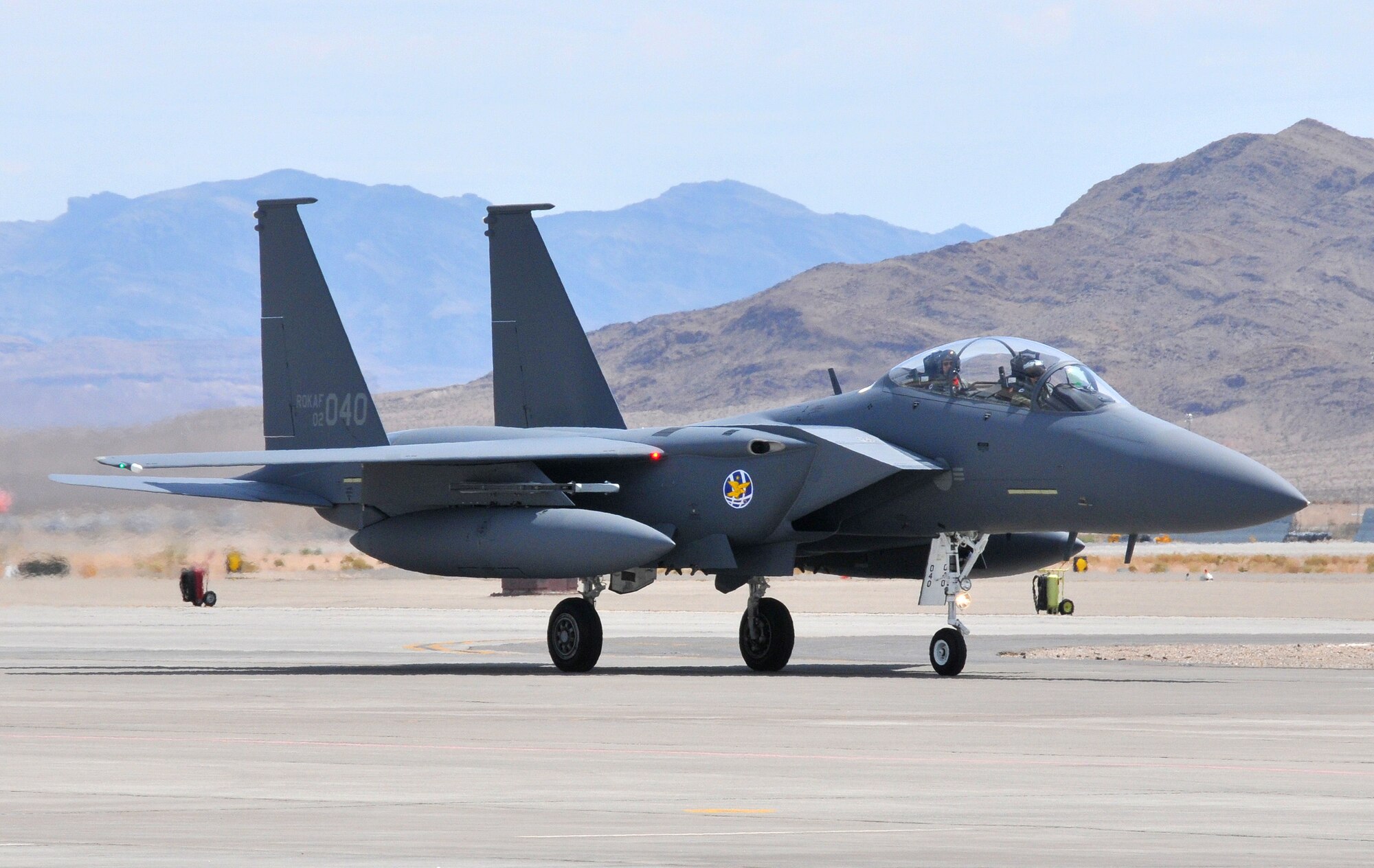 An F-15K Slam Eagle from the Republic of Korea Air Force's 122nd Fighter Squadron taxis at Nellis Air Force Base, Nev. on 5 Aug. upon arrival for Red Flag 08-4.  ROKAF aircraft and crews are participating in their first Red Flag exercise, which provides a peacetime "battlefield" within which U.S. and allied aircrews train to fight, survive and win.  (U.S. Air Force photo by Chief Master Sgt. Gary Emery) 