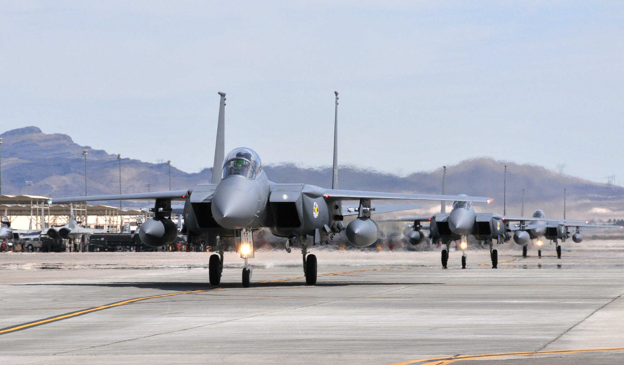 F-15K Slam Eagles from the Republic of Korea Air Force's 122nd Fighter Squadron arrive at Nellis Air Force Base, Nev. on 5 Aug. to participate in Red Flag 08-4.  ROKAF aircraft and crews are participating in their first Red Flag exercise, which provides a peacetime "battlefield" within which U.S. and allied aircrews train to fight, survive and win.  (U.S. Air Force photo by Chief Master Sgt. Gary Emery) 

