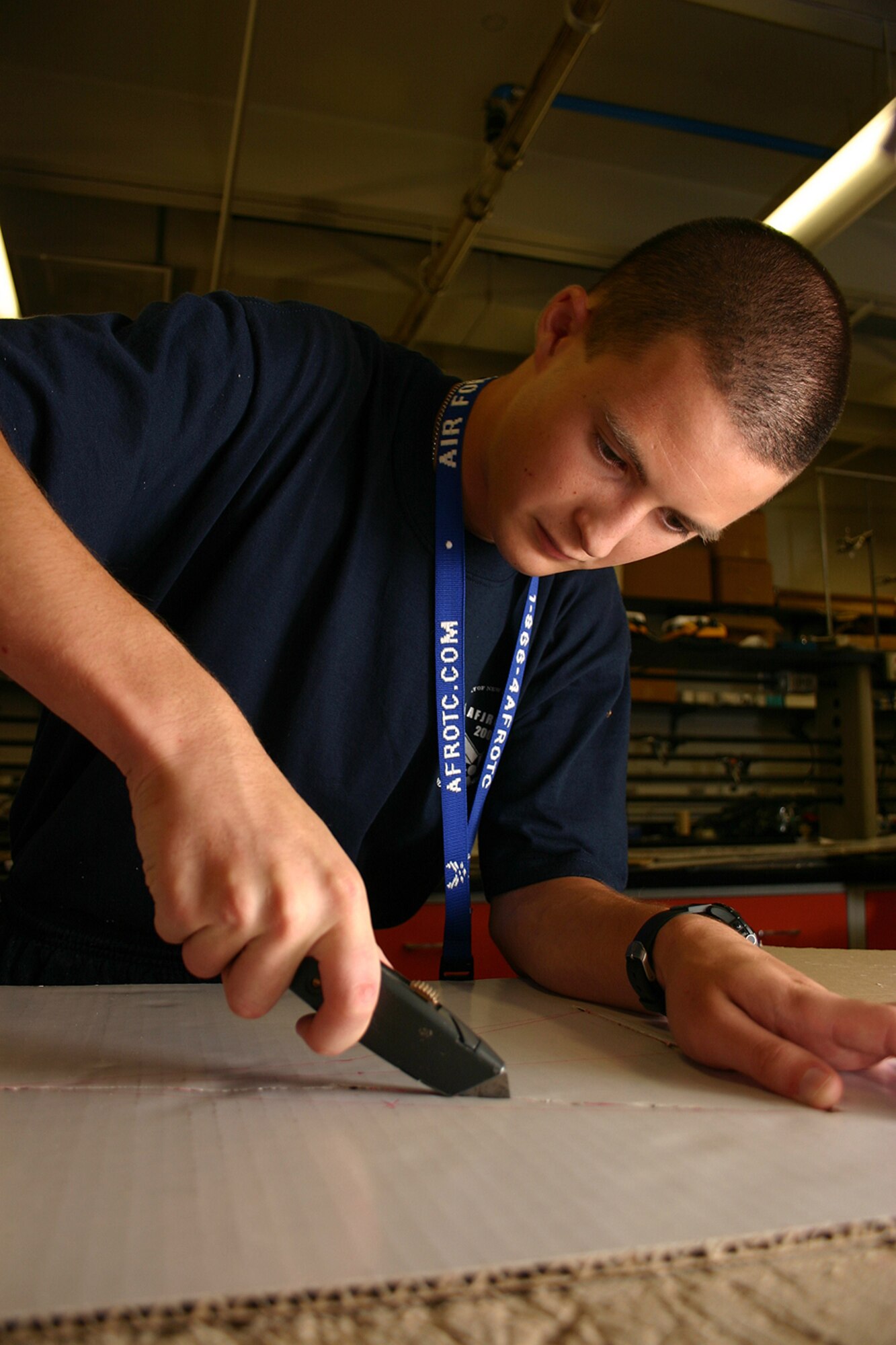 Air Force Junior ROTC Cadet Thomas Murphy from California carves out the frame of his team's rocket car July 29 during the 2008 Air Force Junior ROTC Aerospace and Technology Honor Camp rocket car contest at Albuquerque, N.M.  More than 450 cadets from Junior ROTC units worldwide participated in a total of eight camps with 54 students each - half at Albuquerque and half at Norman, Okla., and Tinker AFB. (U.S. Air Force photo/Staff Sgt. Jason Lake)