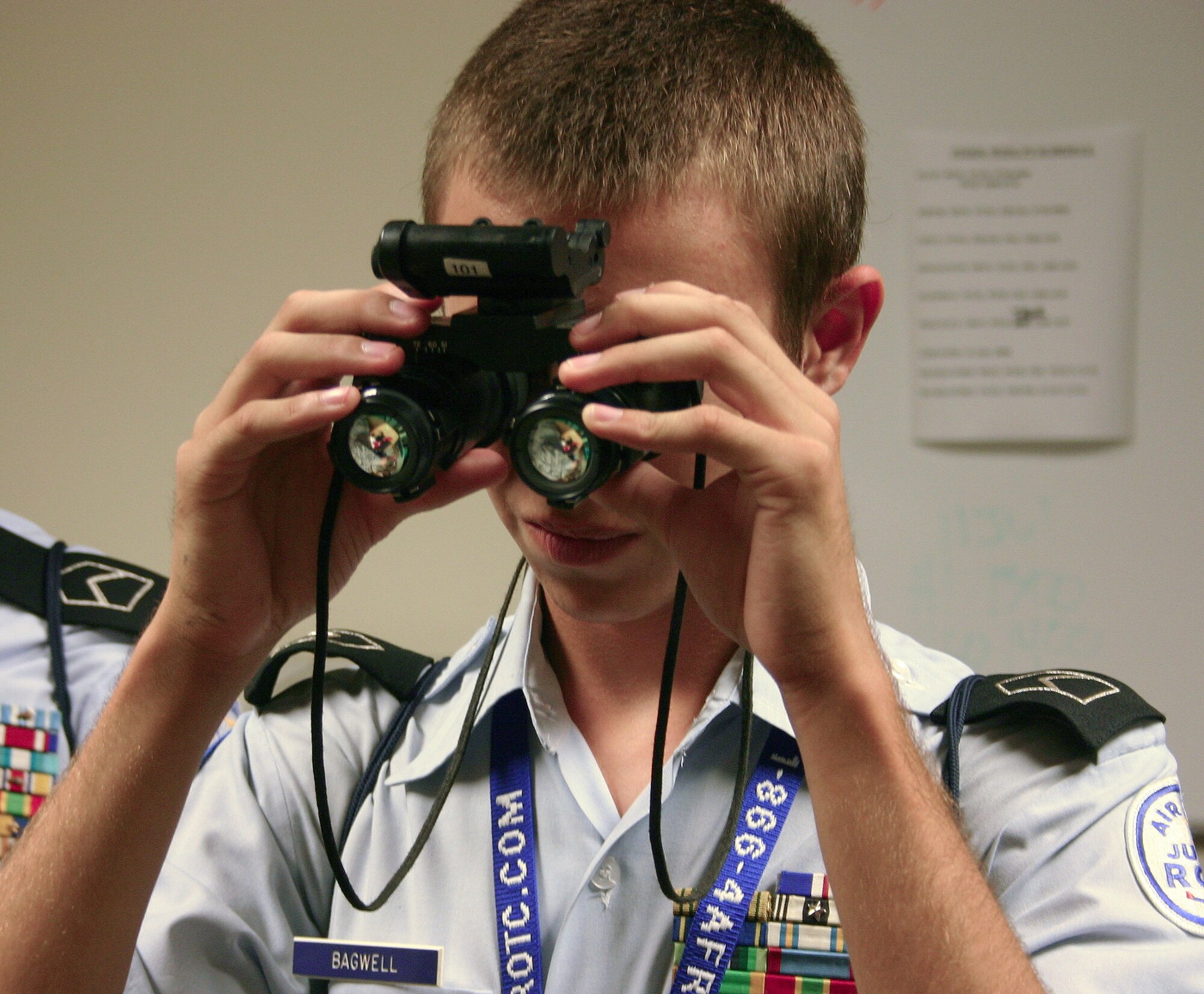 Junior ROTC Cadet Nicolas Bagwell from Texas tries out a pair of night vision goggles during a visit to the 58th Special Operations Wing at Kirtland Air Force Base, N.M . More than 50 cadets from 20 states nationwide visited the 58th SOW as part of the 2008 Air Force Junior ROTC Aerospace and Technology Honor Camp held July 26-31. (U.S. Air Force photo/Staff Sgt. Jason Lake)