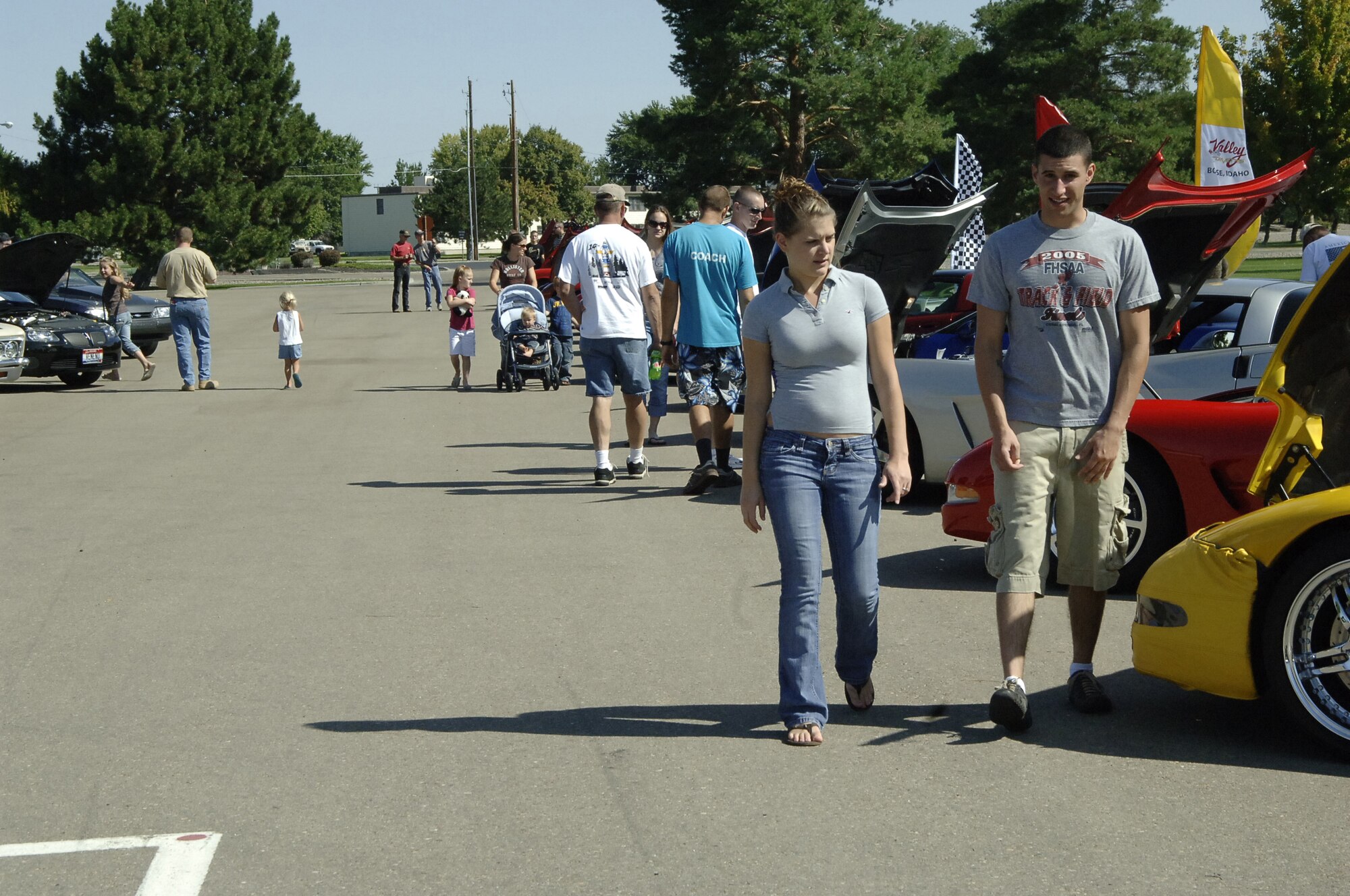 MOUNTAIN HOME AIR FORCE BASE, Idaho -- Spectators check out the vehicles at the Focus 56 Auto Showdown, which took place Aug. 2 at Holt Park. Forty cars, seven trucks and four motorcycles registered for the auto show, which raised more than $900 for the Focus 56 council. The event was made possible by the hard work of more than 50 volunteers from across the wing. (U.S. Air Force photo by Staff Sgt. Jasmine Reif) 
