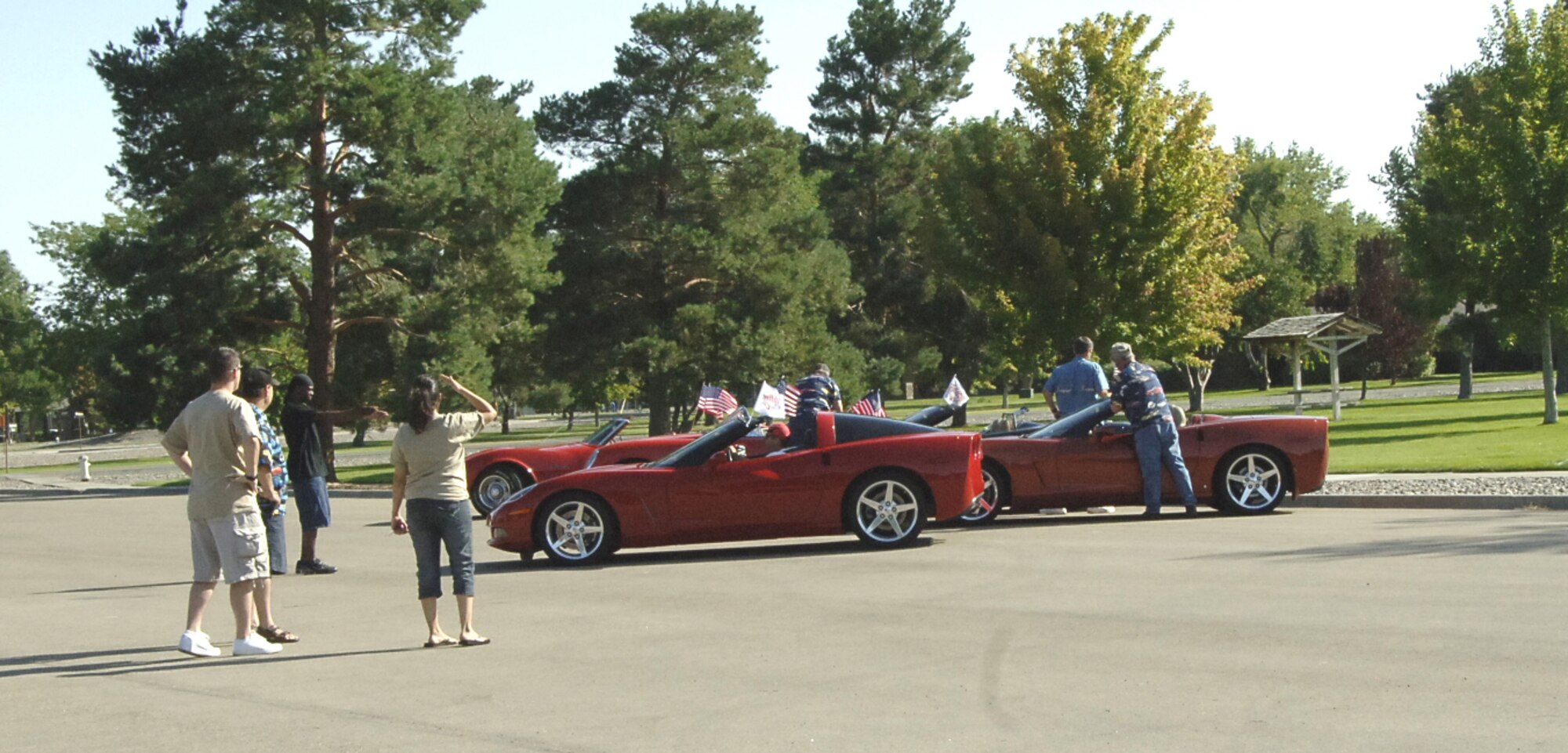 MOUNTAIN HOME AIR FORCE BASE, Idaho -- Members of the Focus 56 Executive Council and volunteers help park vehicles at the Focus 56 Auto Showdown, which took place Aug. 2 at Holt Park. Forty cars, seven trucks and four motorcycles were registered for the auto show, which raised more than $900 for the Focus 56 council. The event was made possible by the hard work of more than 50 volunteers from across the wing. (U.S. Air Force photo by Staff Sgt. Jasmine Reif) 