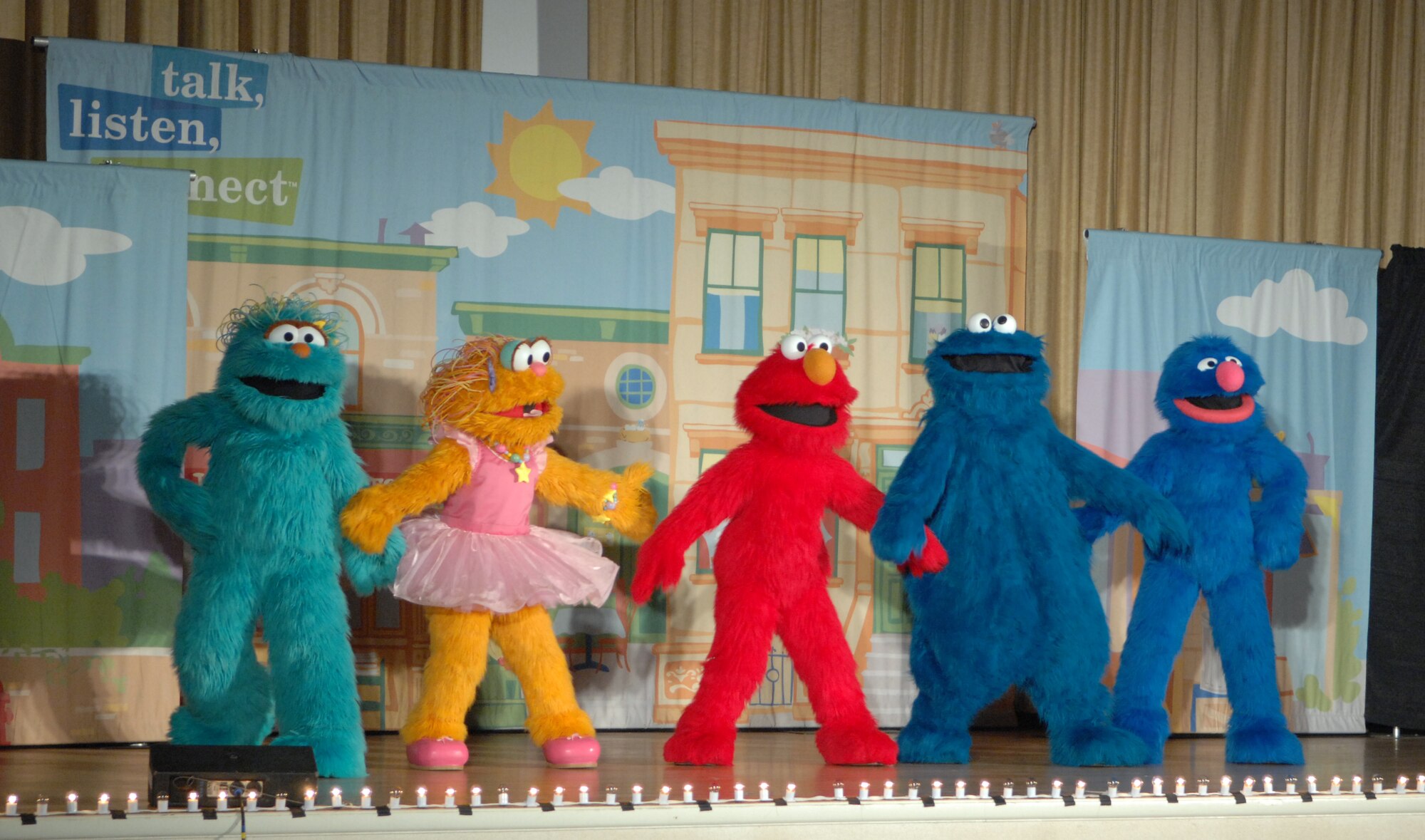 MOUNTAIN HOME AIR FORCE BASE, Idaho -- Characters from Sesame Street perform for children at the Mountain Home Air Force Base during a free Sesame Street Live show teaching children what a deployment means to them and their family. The tour is part of Sesame Workshop's “Talk, Listen, Connect” initiative, a military outreach program, which launched in 2006. Story lines are designed to help families understand and talk about the difficulties of multiple deployments, homecomings and changes in parents, whether physical or psychological. (U.S. Air Force photo/Airman 1st Class Ashley Winters)