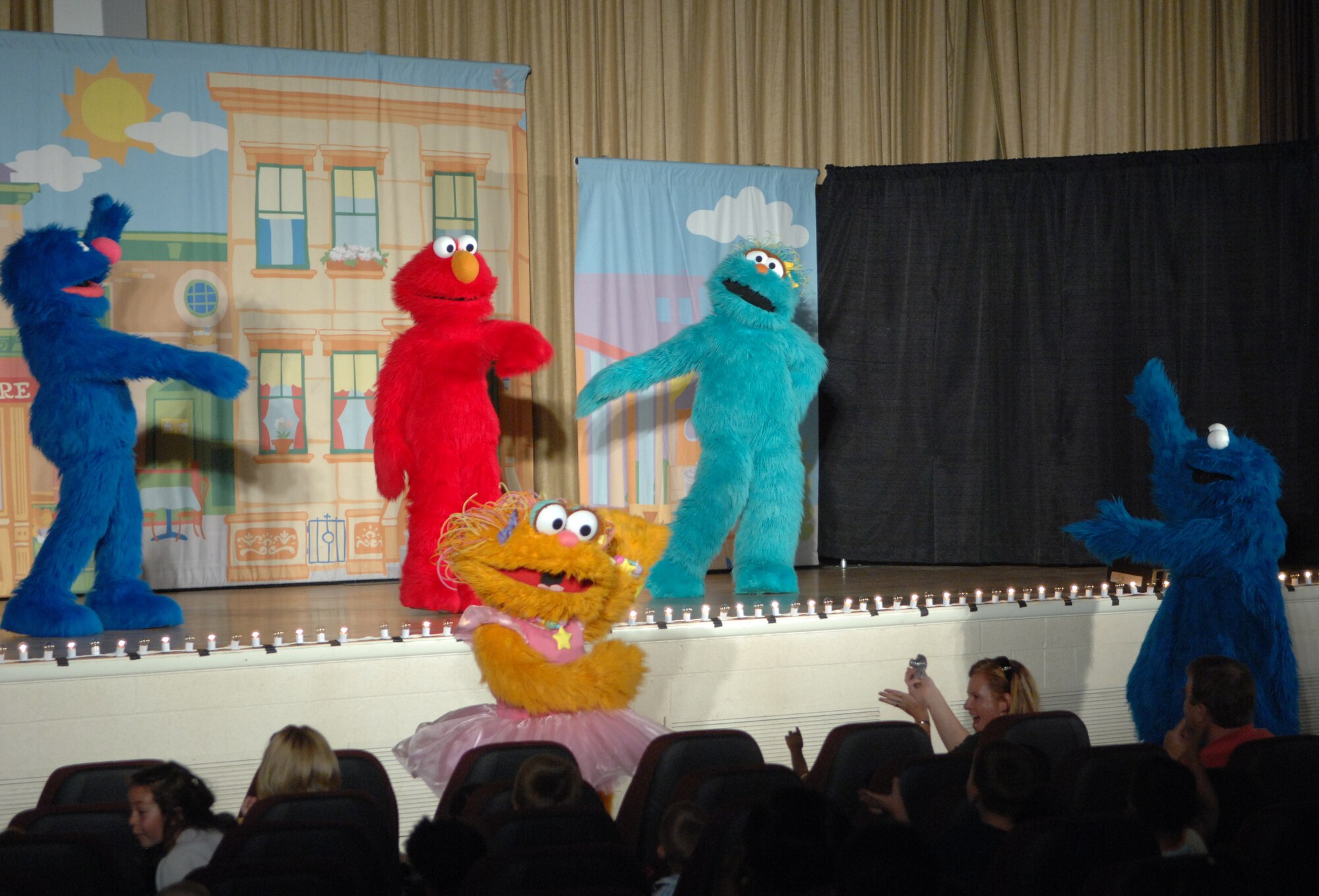 MOUNTAIN HOME AIR FORCE BASE, Idaho -- Characters from Sesame Street perform for children at the Mountain Home Air Force Base during a free Sesame Street Live show teaching children what a deployment means to them and their family. The tour is part of Sesame Workshop's “Talk, Listen, Connect” initiative, a military outreach program, which launched in 2006. Story lines are designed to help families understand and talk about the difficulties of multiple deployments, homecomings and changes in parents, whether physical or psychological. (U.S. Air Force photo/Airman 1st Class Ashley Winters)