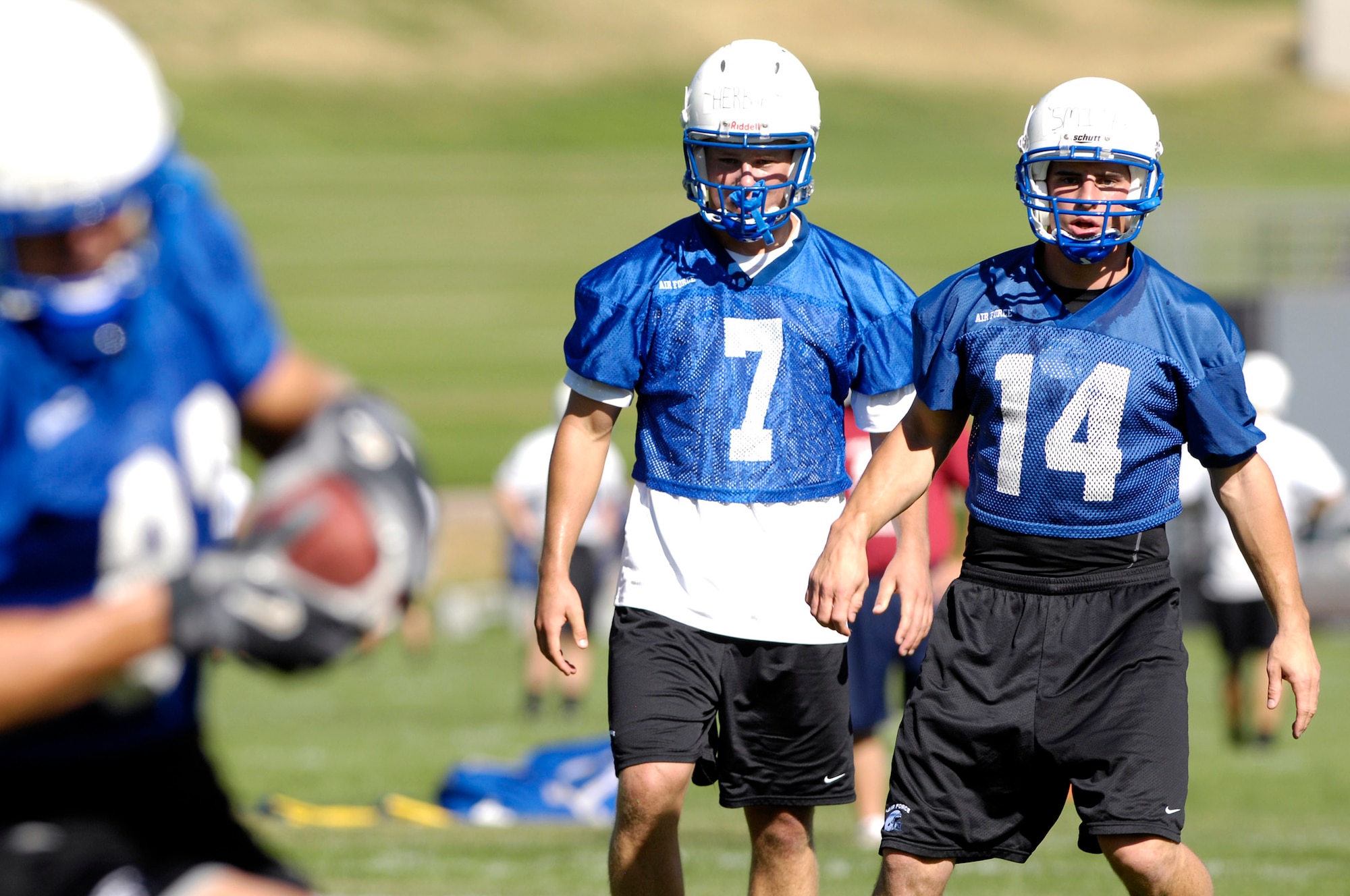 Cadet 2nd Class Eric Herbort (7) and Cadet 1st Class Shea Smith participate in pass drills as the Falcons practice in preseason camp July 31 at the U.S. Air Force Academy in Colorado. The Falcons had their best Mountain West Conference record in school history in 2007 with a 9-4 record. (U.S. Air Force photo/Mike Kaplan) 
