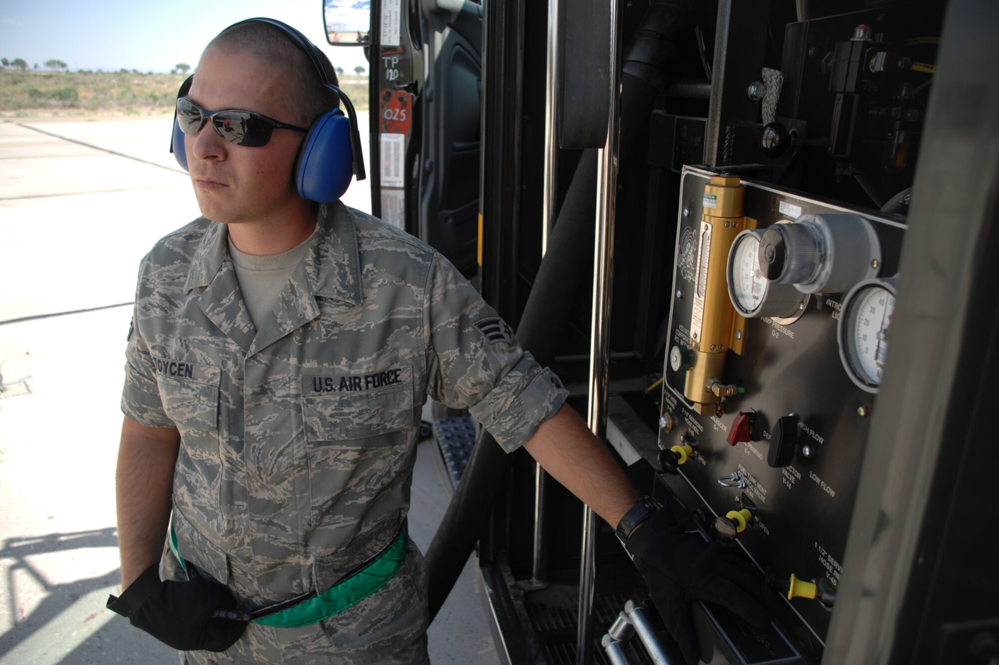 Senior Airman Kurtis Toycen, 49th Logistics Readiness Squadron, operates the control panel of a R-11 fuel truck during the hot refueling of an F-22A Raptor July 23 at Holloman Air Force Base, N.M. During the procedure, Airman Toycen served as the refueling equipment operater. (U.S. Air Force photo/Airman 1st Class Jamal D. Sutter)