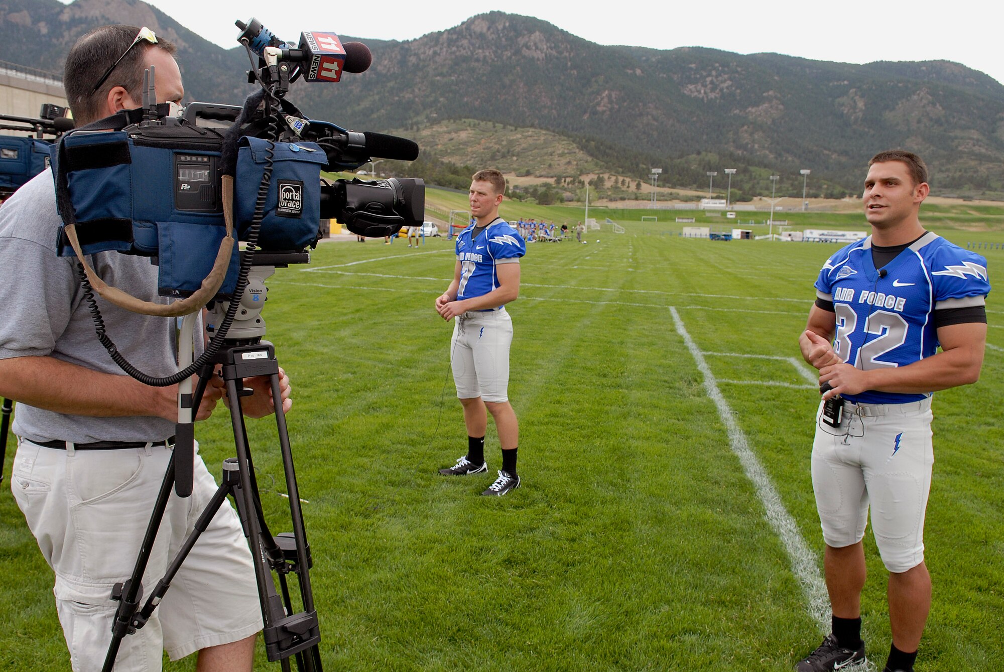 Outside linebacker Cadet 1st Class Hunter Altman (32) and quarterback Cadet 2nd Class Eric Herbort (7) talk to the media July 30 at the U.S. Air Force Academy in Colorado. (U.S. Air Force photo/Mike Kaplan)
