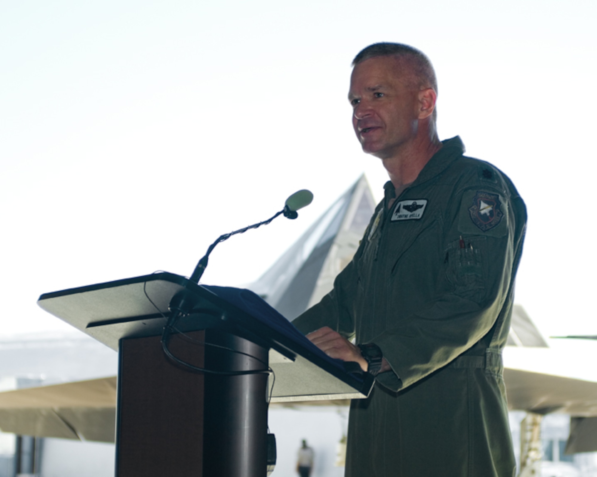 Lt. Col. Dwayne Opella, 410th Flight Test Squadron commander, speaks to the audience during the squadron's inactivation ceremony Aug. 1 at the U.S. Air Force Plant 42 in Palmdale, Calif. The 410th FLTS was responsible for performing flight test missions for the F-117 Nighthawk, the world's first operational aircraft designed to exploit low-observable stealth technology. (Air Force photo by Mike Yncera)