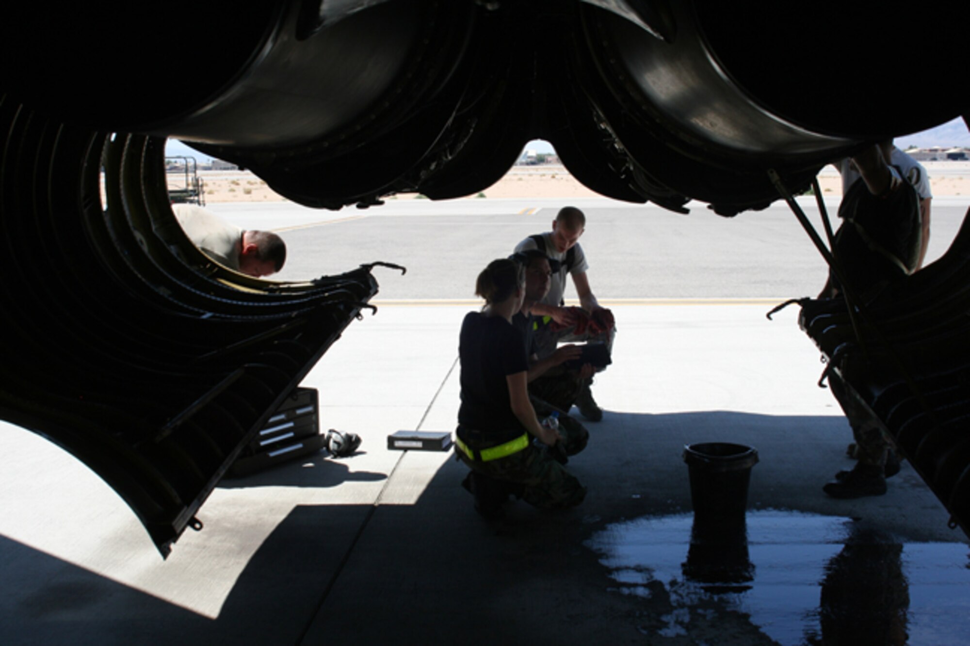 NELLIS AIR FORCE BASE, Nev. – Warbird maintainers take refuge from the desert sun while performing routine maintenance on a B-52H Stratofortress here July 27. The Airmen performed maintenance in support of Red Flag 08-03, a two-week, realistic combat training exercise involving the air forces of the United States and its allies. Almost 150 Warbirds participated in the exercise, which ended Aug. 1. (U.S. Air Force photo by Airman 1st Class Wesley Wright)