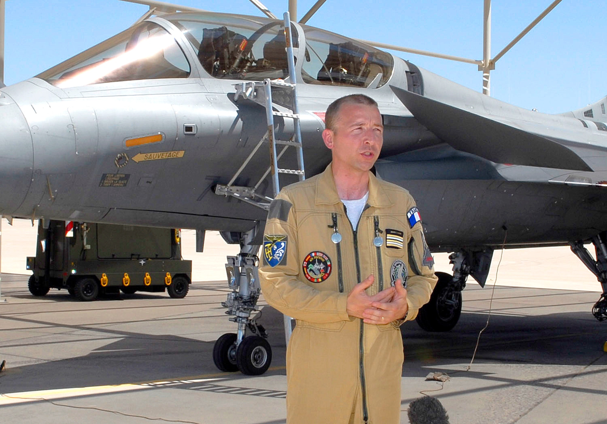 Lt. Col. Fabrice Granclaudon, French air force squadron commander, stands in front of a French Rafale aircraft while being interviewed by TF1 (French media) at Luke AFB, July 28. Four Rafale aircraft and more than 100 French airmen deployed for the first time on U.S. soil for an exercise July 28-Aug8 at Luke. (U.S. Air Force photo by TSgt. Nabor)