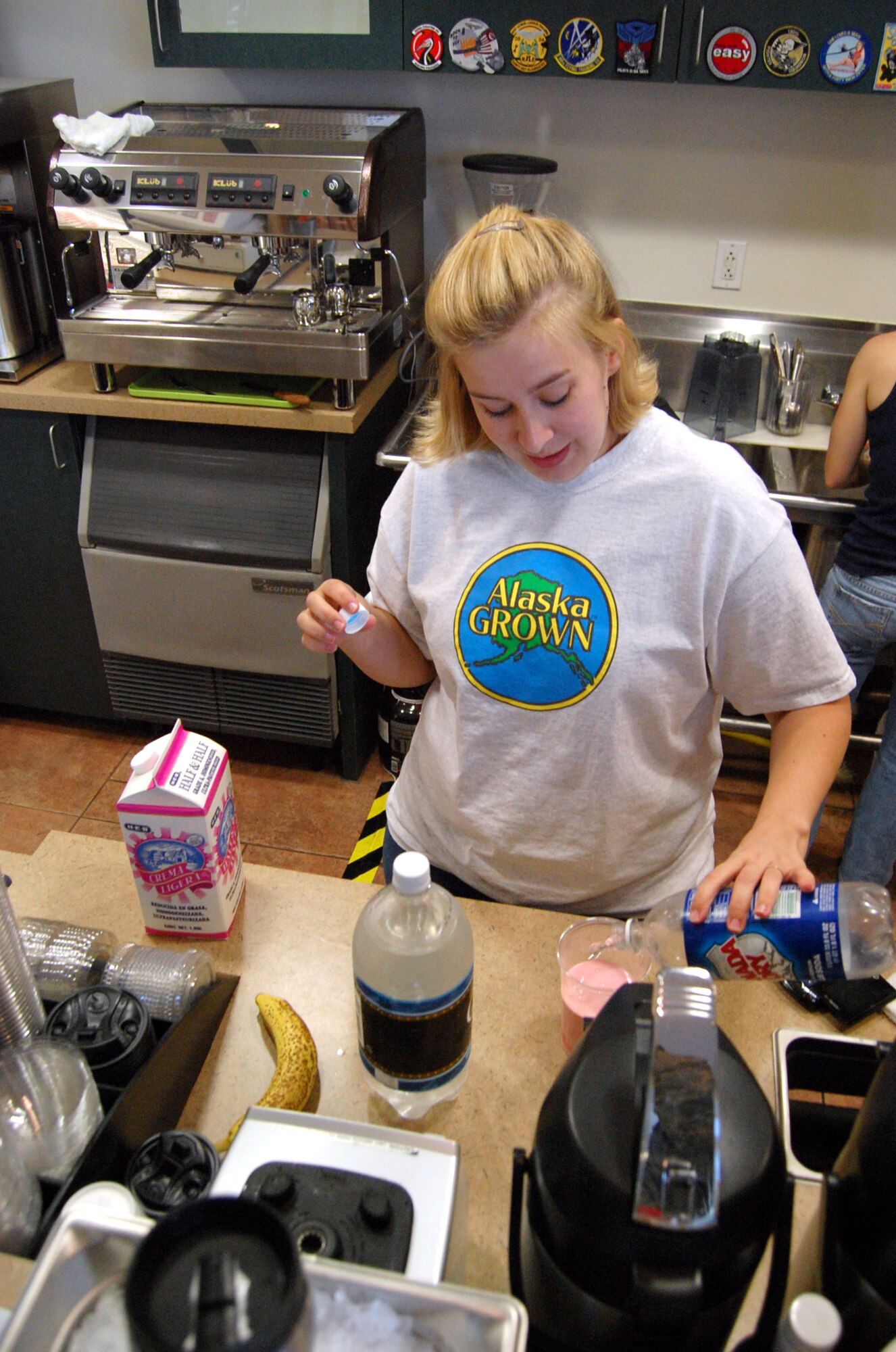 LAUGHLIN AIR FORCE BASE, Texas -- Kaitie May, Coffee Now II manager, prepares an Italian Cream Soda for a customer Aug. 4.  The small coffee shop opened in the Losano Fitness Center in June and offers a wide variety of hot and cold drinks and snacks.  (Contributed photo)
