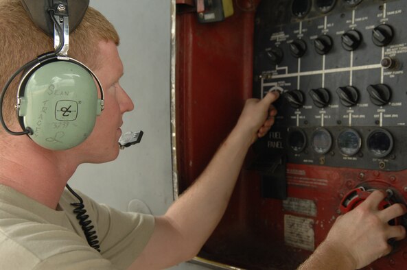 Senior Airman Sean Tracey, 755th Aircraft Maintenance Squadron crewchief, prepares a C-130 aircraft to transfer fuel during ground operations here, July 10. (U.S. Air Force photo/Airman 1st Class Noah R. Johnson)