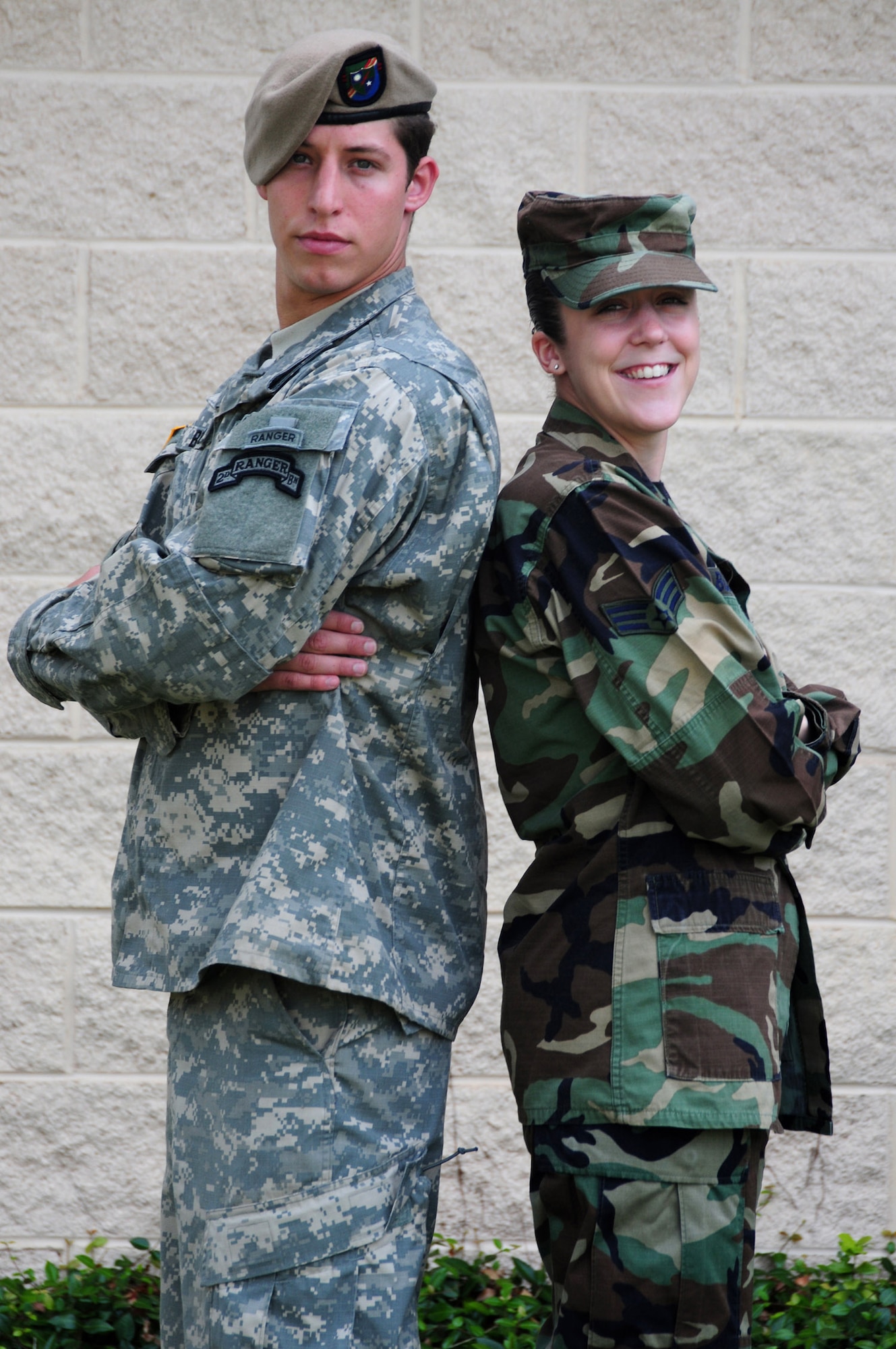 Siblings Army Sgt. William Bullock III and Senior Airman Mary Bullock stand together July 28 at Hurlburt Field, Fla. They said their grandfather, a World War II veteran, was their greatest influence growing up. Sergeant Bullock followed in his footsteps by becoming an Army Ranger. Inspired by both her grandfather and her younger brother, Airman Bullock joined the Air Force. Today, the brother and sister duo sometimes find themselves working together despite being in different services. (U.S. Air Force photo/Senior Master Sgt. Terry Blevins) 
