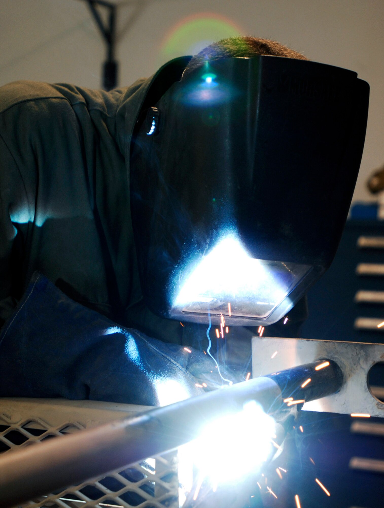 Senior Airman Joseph Krafchak uses an arc welder to repair an aircraft maintenance stand Aug. 2 at Joint Base Balad, Iraq. Aircraft maintainers use the stands to perform maintenance on F-16 Fighting Falcons. Airman Krafshak, a metals technician journeyman with the 332nd Expeditionary Maintenance Squadron here, is deployed from Shaw Air Force Base, S.C. His hometown is Lompoc, Calif. (U.S. Air Force photo/Airman 1st Class Jason Epley) 
