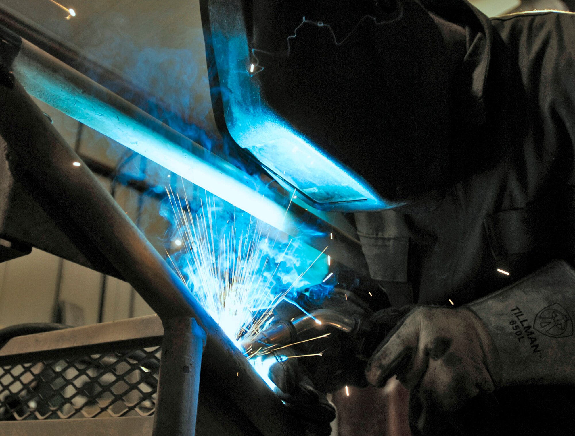 Senior Airman Joseph Krafchak uses an arc welder to repair an aircraft maintenance stand Aug. 2 at Joint Base Balad, Iraq. Aircraft maintainers use the stands to perform maintenance on F-16 Fighting Falcons. Airman Krafshak, a metals technician journeyman with the 332nd Expeditionary Maintenance Squadron here, is deployed from Shaw Air Force Base, S.C. His hometown is Lompoc, Calif. (U.S. Air Force photo/Airman 1st Class Jason Epley) 
