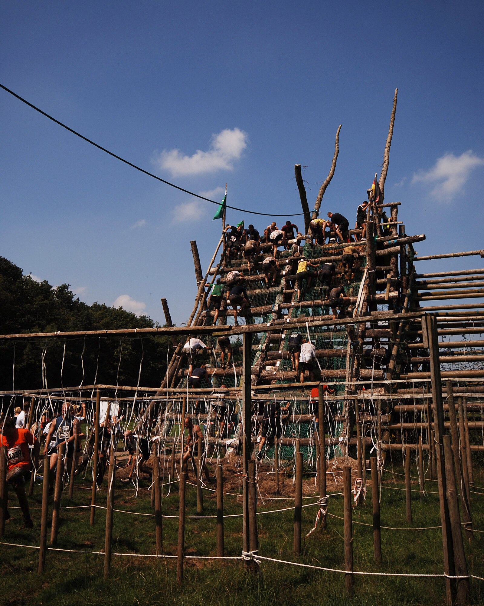 The "High Leopard" - you needed to complete it twice to finish!.  This was just one of the many challenging obstacles to competitors in the Tough Guy Nettle Warrior XI challenge held July 27th in Perton, England.  The JIOCEUR Analytic Center at RAF Molesworth, United Kingdom fielded a 9 person team - all of which completed the course and can officially call themselves "Tough Guys." (U.S. Air Force Photo by Staff Sgt. Chad E. Chisholm)