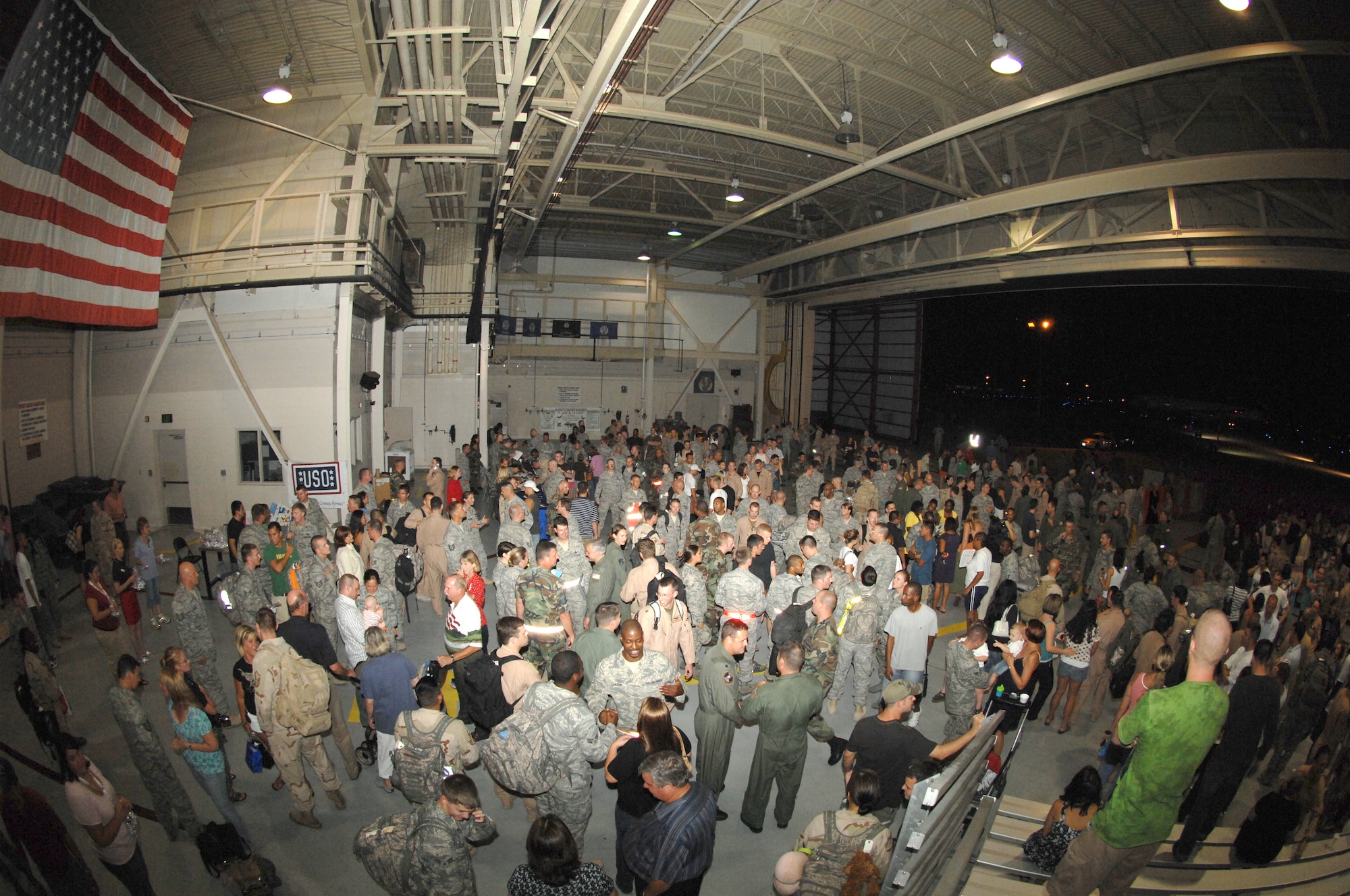 Families, friends and coworkers spend time with the nearly 200 Airmen who were welcomed home from their deployments during the Operation Homecoming celebration which started at 1:30 a.m. Aug. 5. (U.S. Air Force photo/Senior Airman Stephanie Jacobs)
