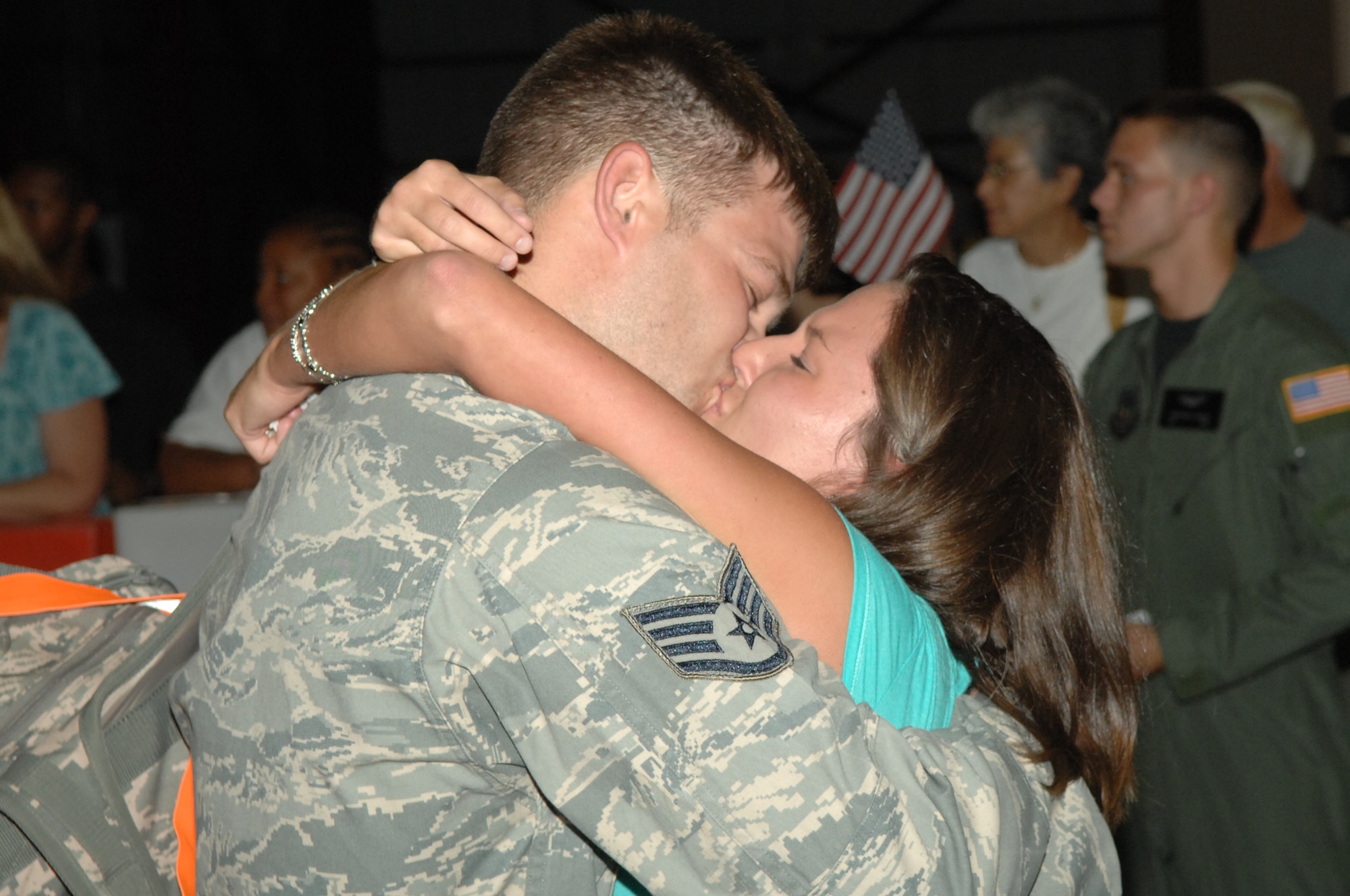 Staff Sgt. Christopher Hurd, 1st Special Operations Equipment Maintenance Squadron, gets a long-awaited kiss from his wife Heather during the Operation Homecoming celebration that started at 1:30 a.m. Aug. 5. Sergeant Hurd was one of nearly 200 Airmen who were welcomed home from their deployments during the ceremony. (U.S. Air Force photo/Senior Airman Stephanie Jacobs)