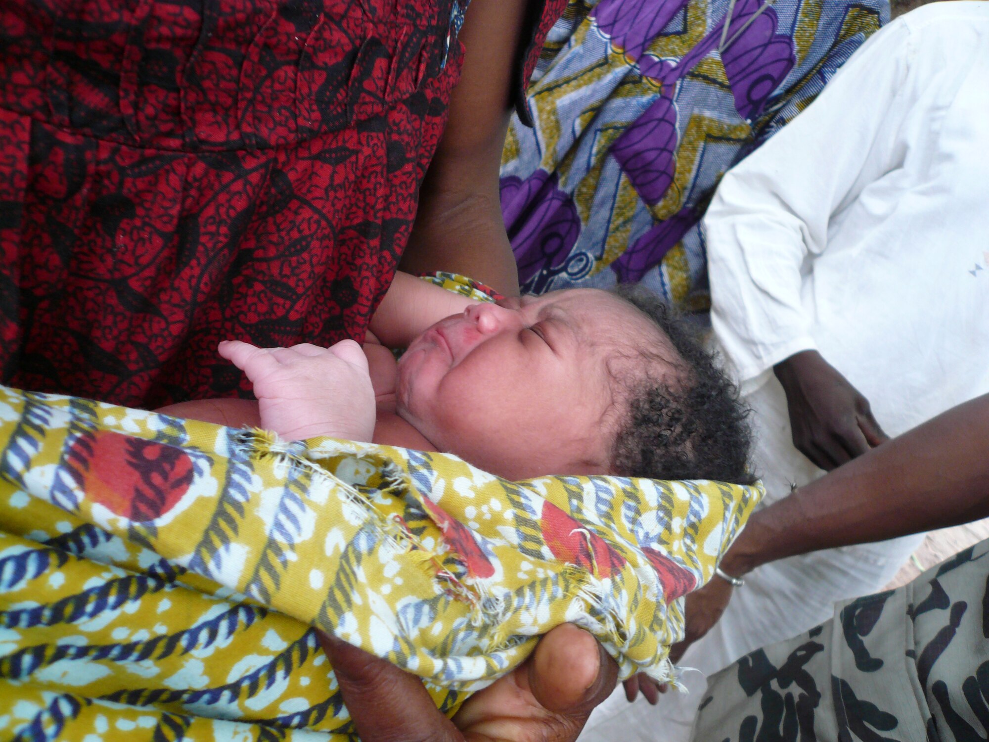 During day three of the MEDFLAG 08 medical team's humanitarian visit, one of the ladies in line for care went into labor and gave birth to a baby girl. In honor of the MEDFLAG team's visit, Colonel McGilvra, MEDFLAG 08 commander, was asked to name her baby. He named her Shelly, after his wife. (U.S. Air Force courtesy photo)